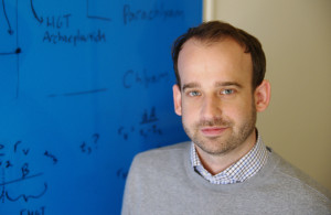 Greg Fournier, a geobiologist at MIT, is searching for the origins of the genetic code.