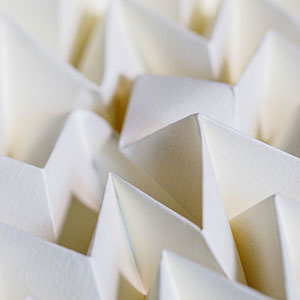 A defect in a beige sheet of Miura-ori