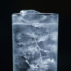A GIF of ice melting in a glass of water