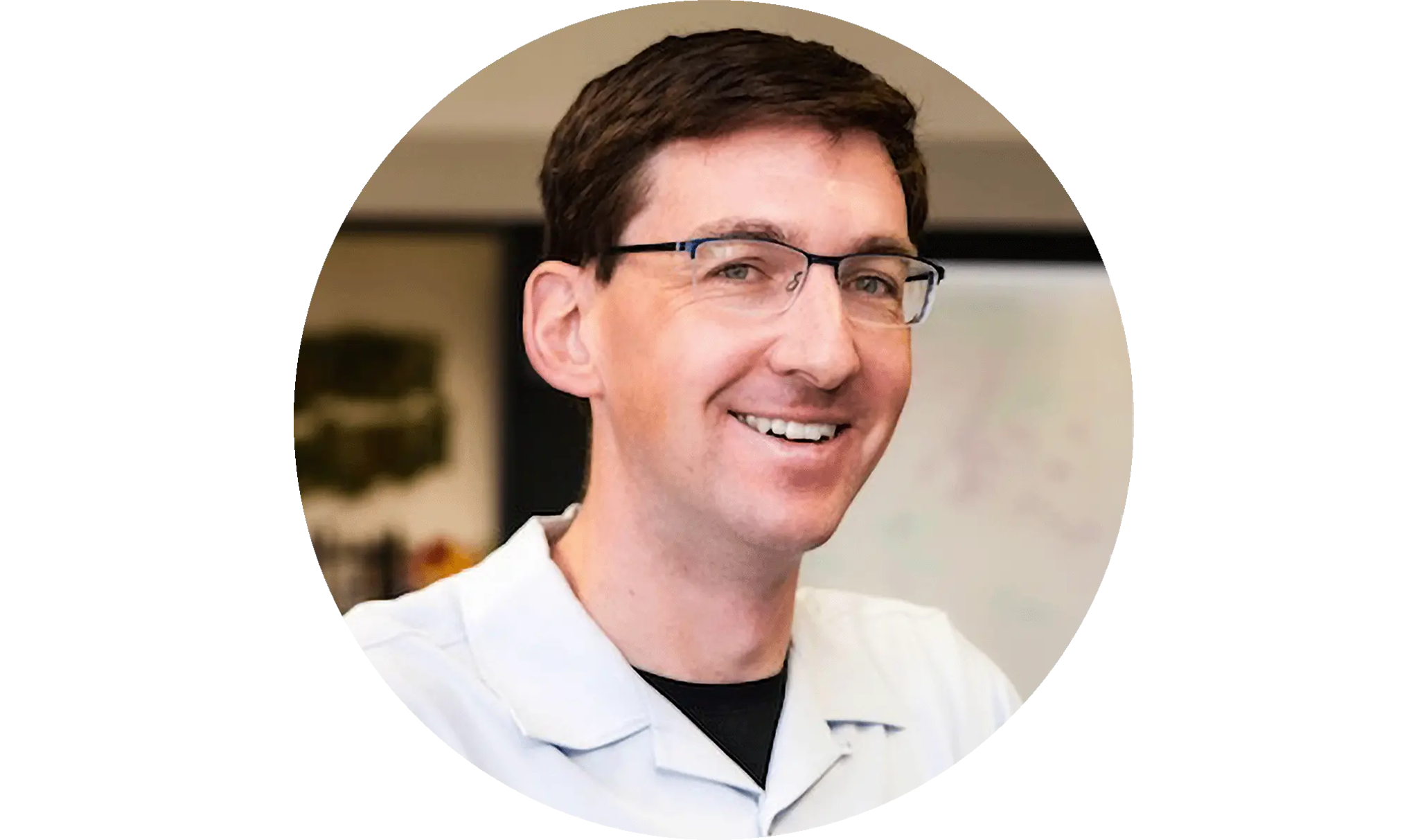 A smiling man with glasses
