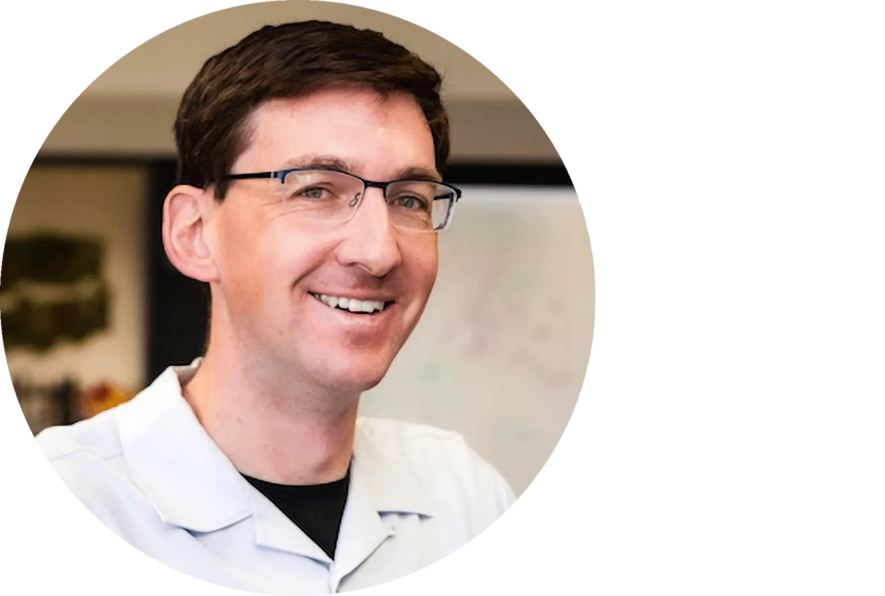 a smiling man with glasses