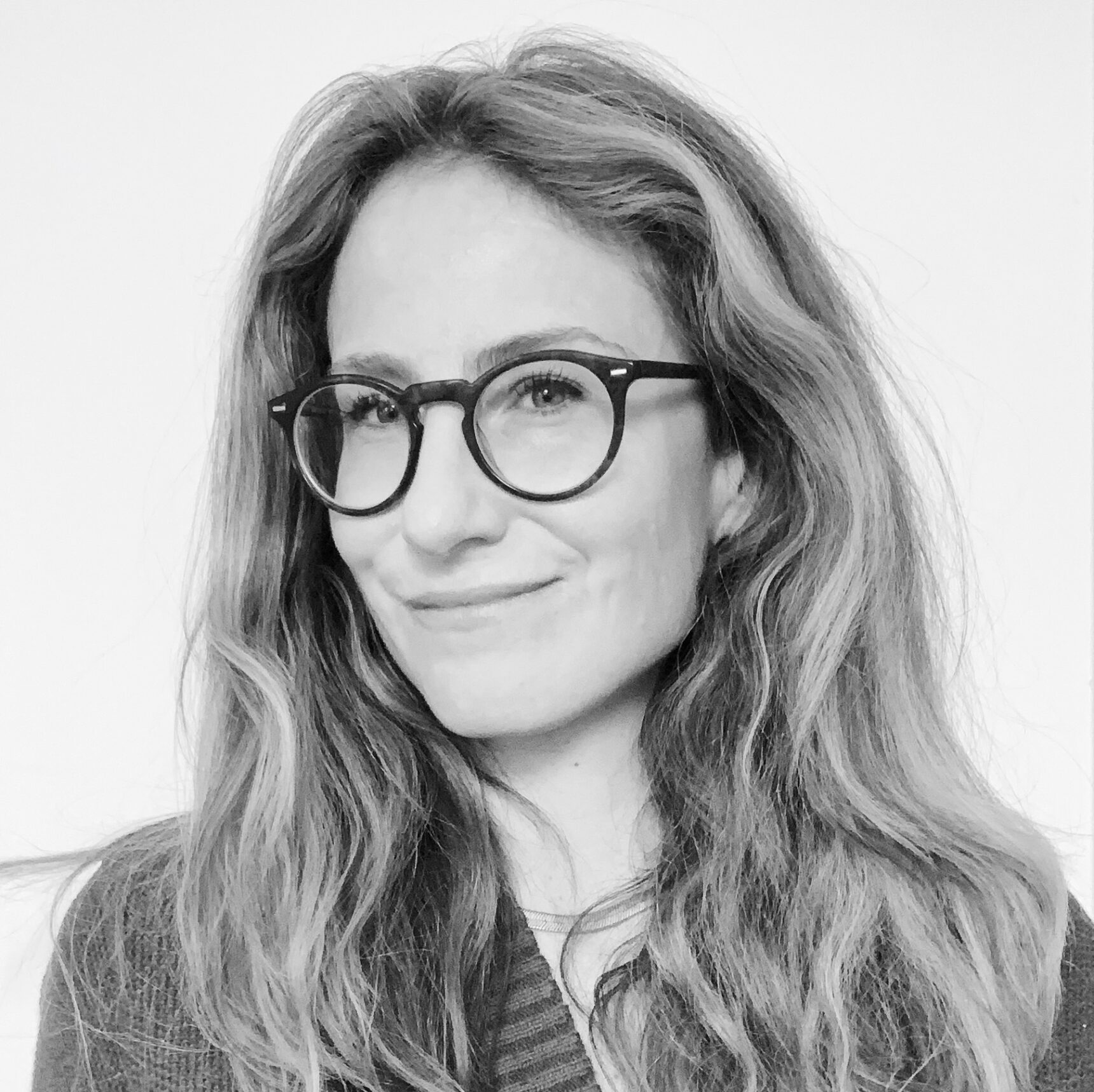 A smiling woman with glasses