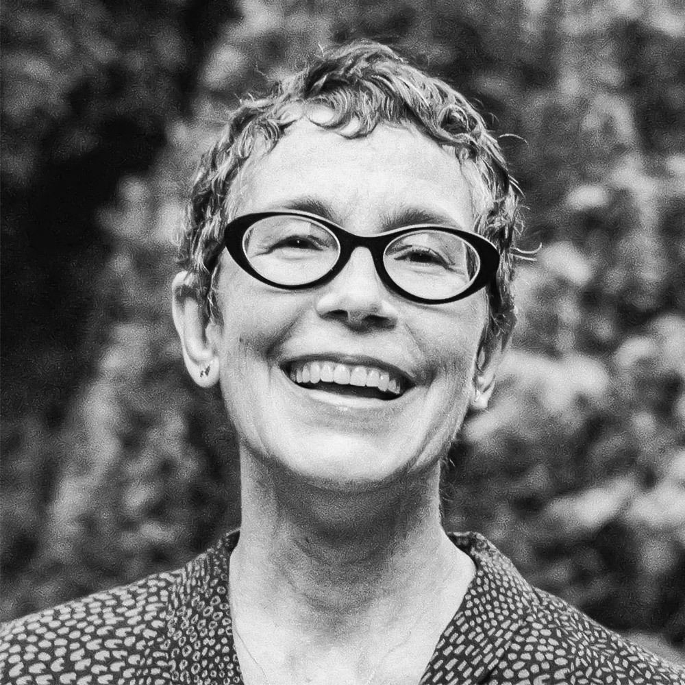 A smiling woman with glasses