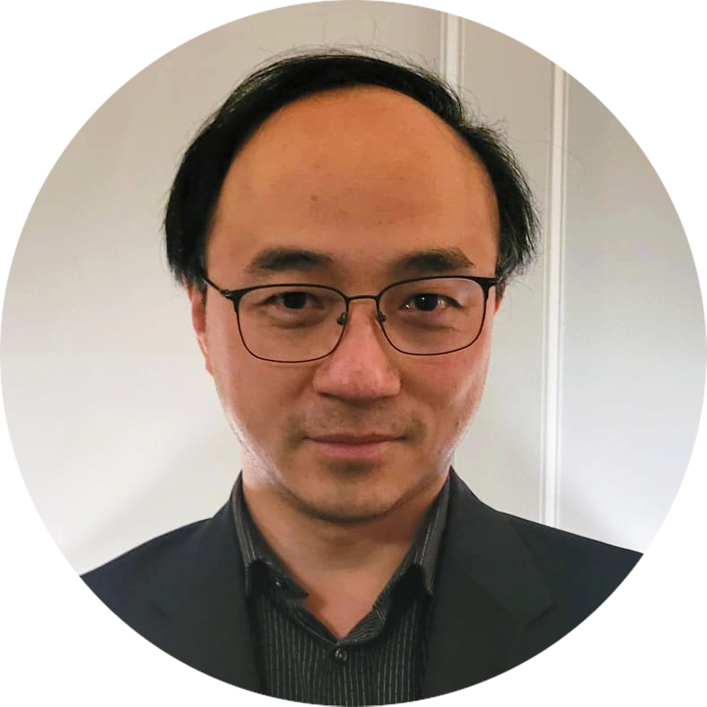 A smiling man with glasses