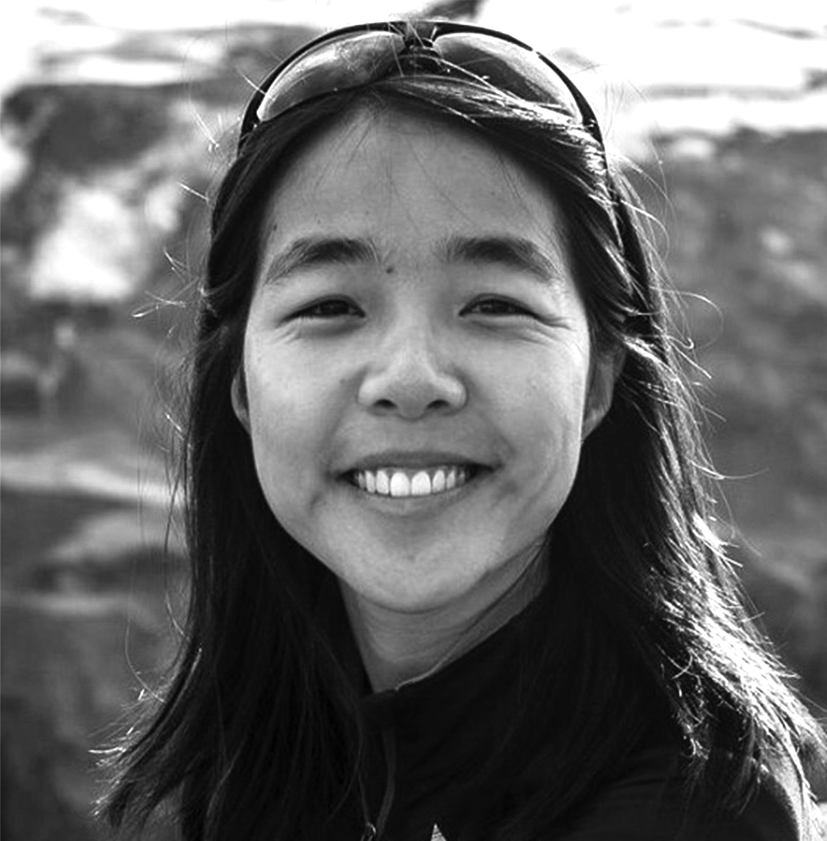 a smiling woman with black hair
