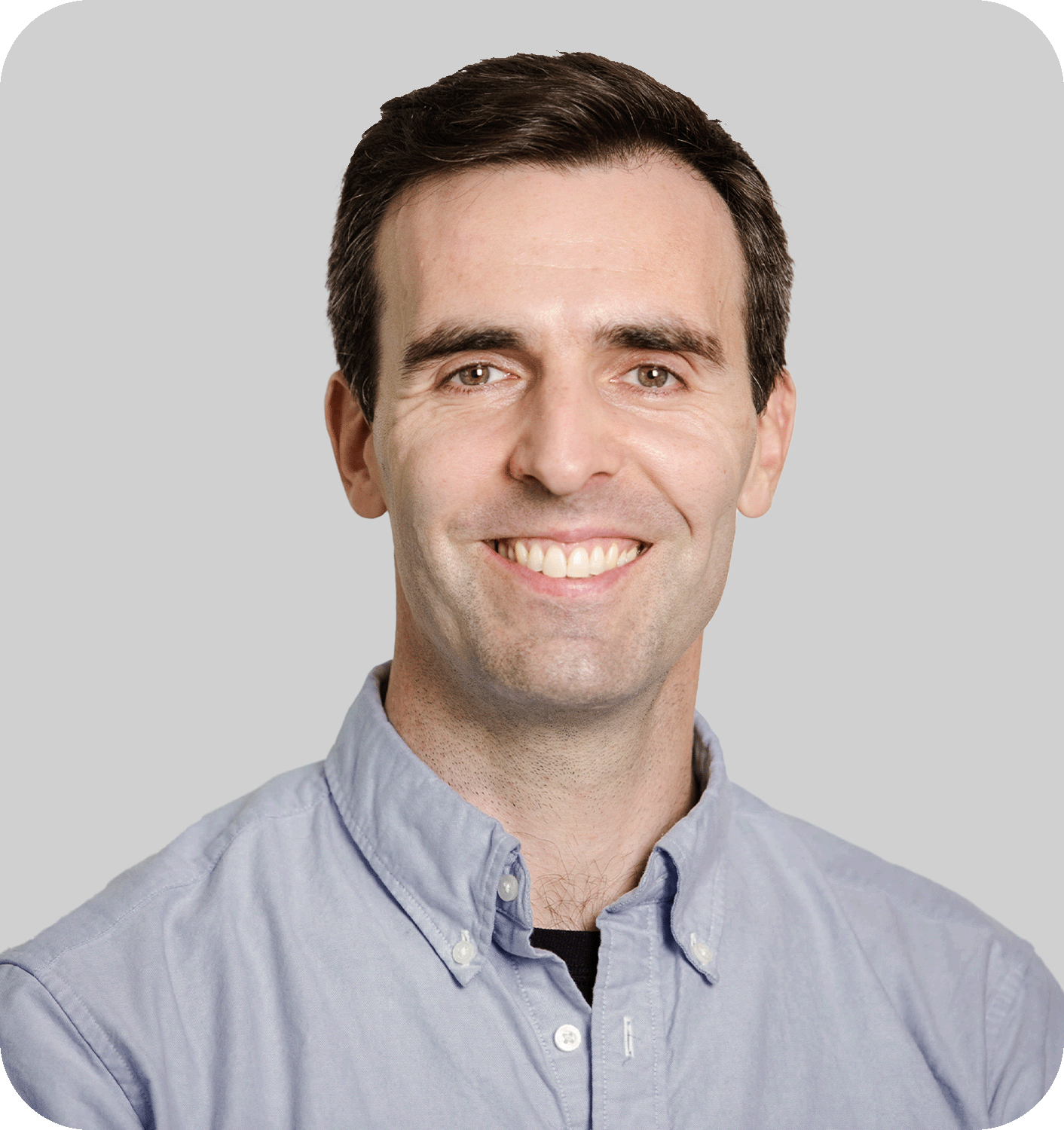A smiling man with brown hair