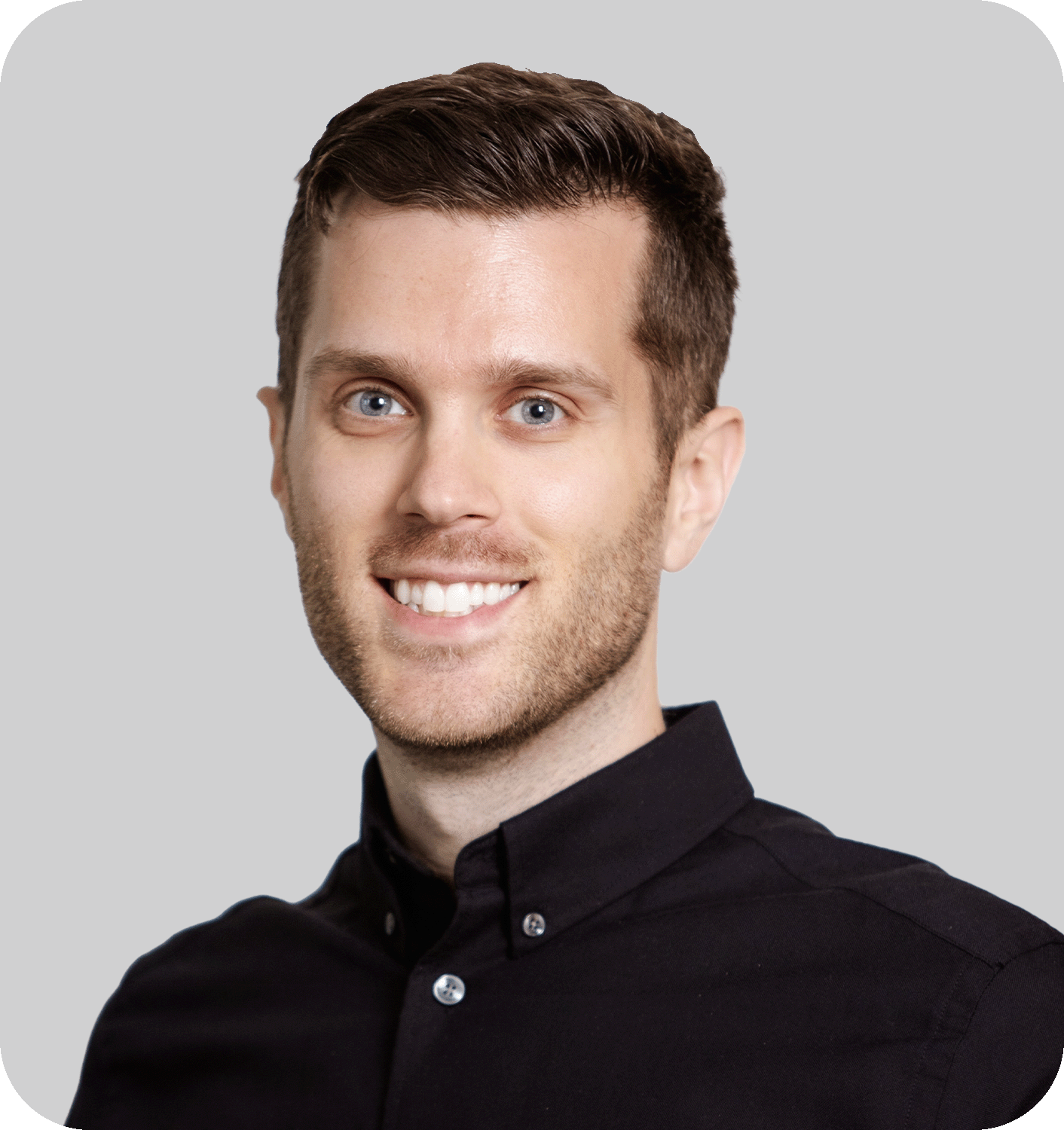 A smiling man with brown hair