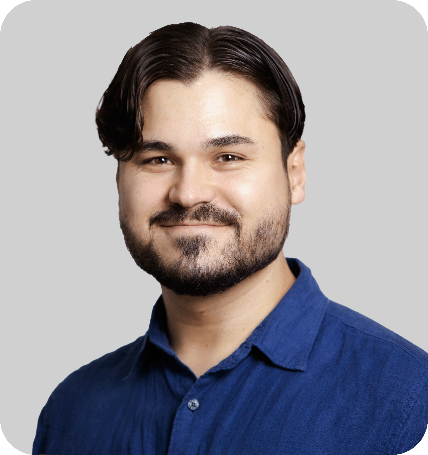 A smiling man with brown hair