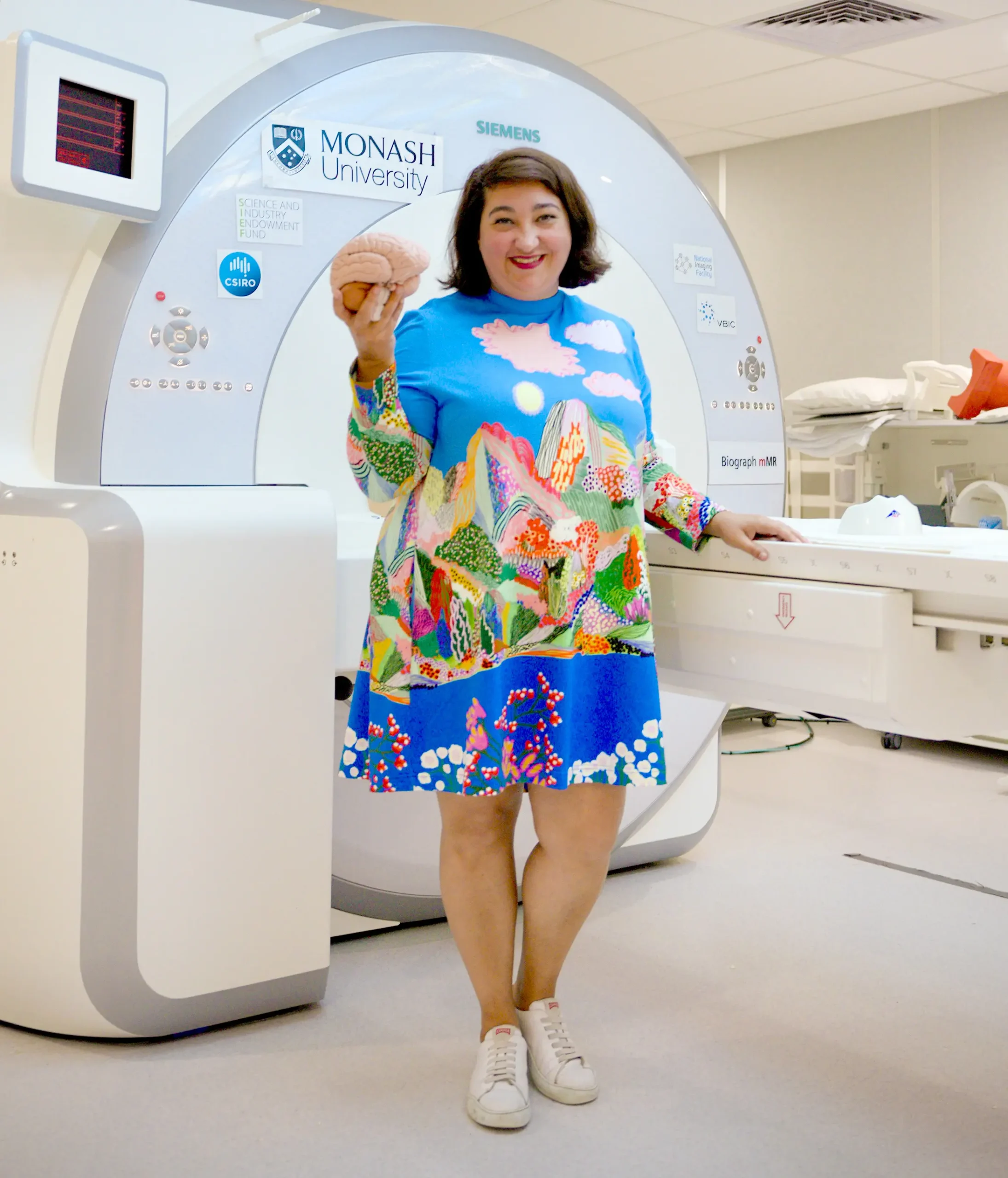Sharna Jamadar poses with a model brain.
