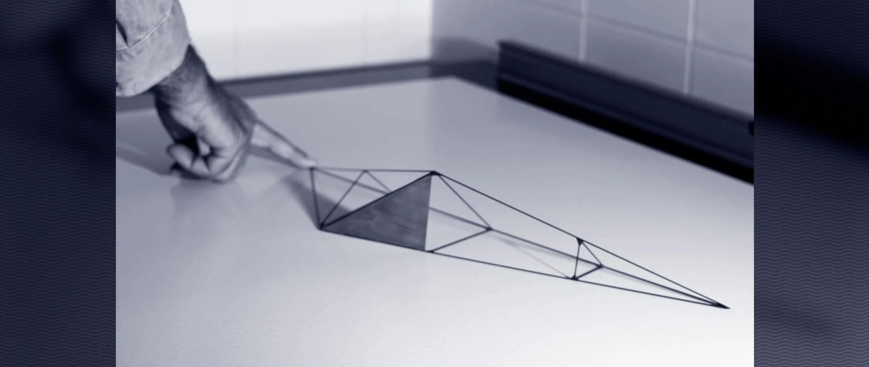 Looping video of a tetrahedral model flipping onto one stable side.