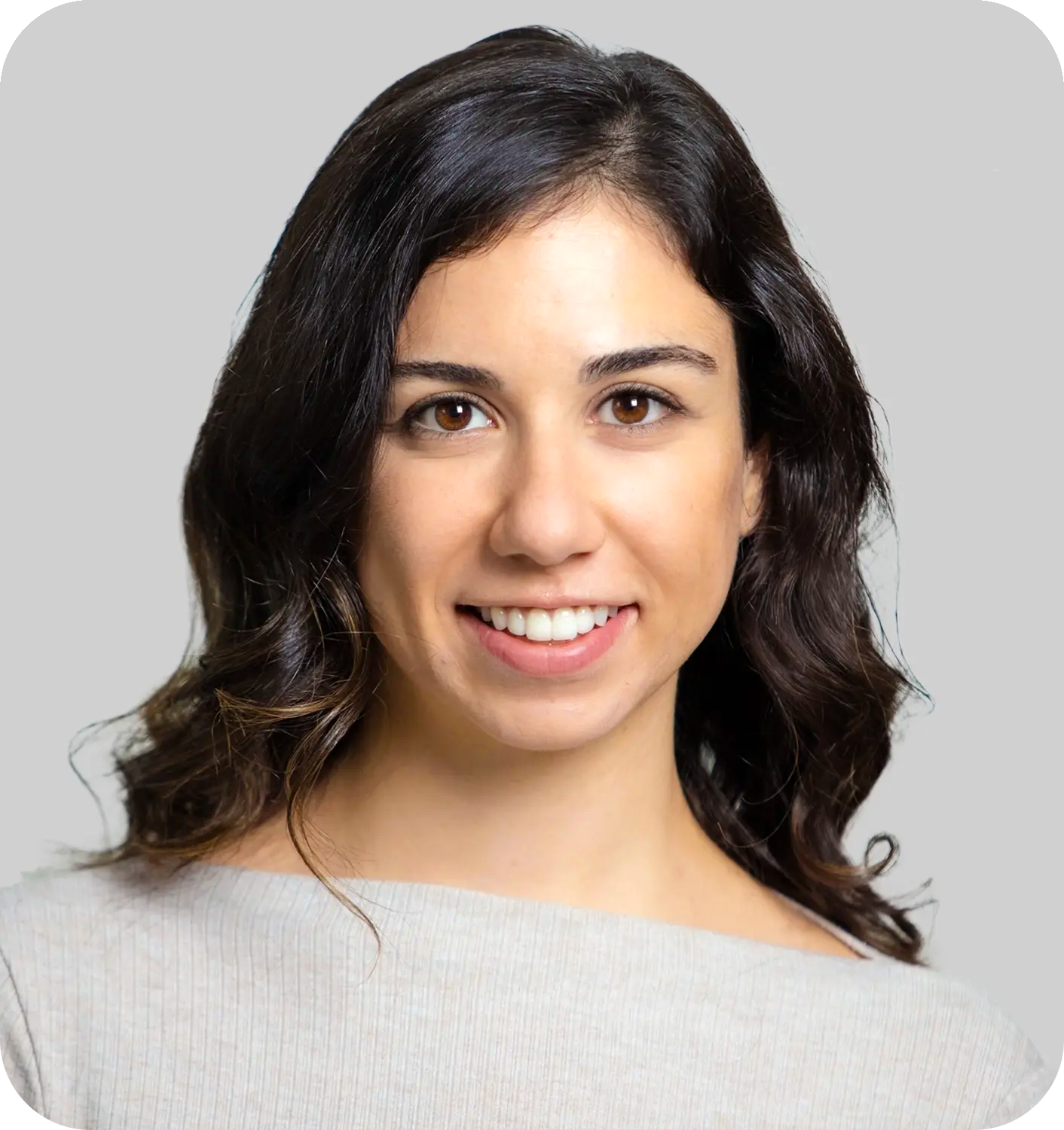 A smiling woman with black hair
