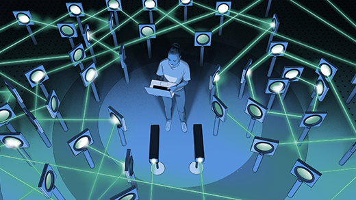 Illustration of a man holding a laptop while standing in the middle of a complicated optics experiment. Green laser beams fly around every which way.
