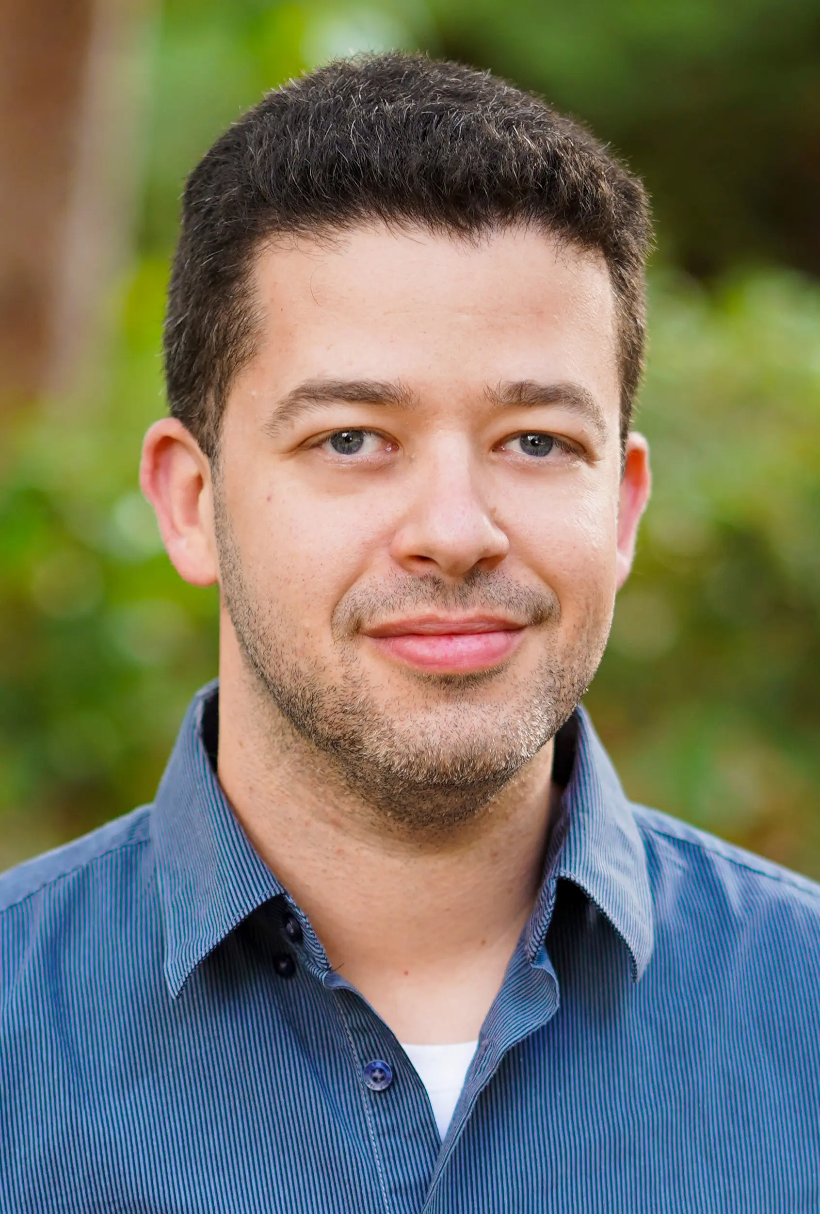 Ron Rothblum, a computer scientist, wearing a dark blue shirt and smiling at the camera.