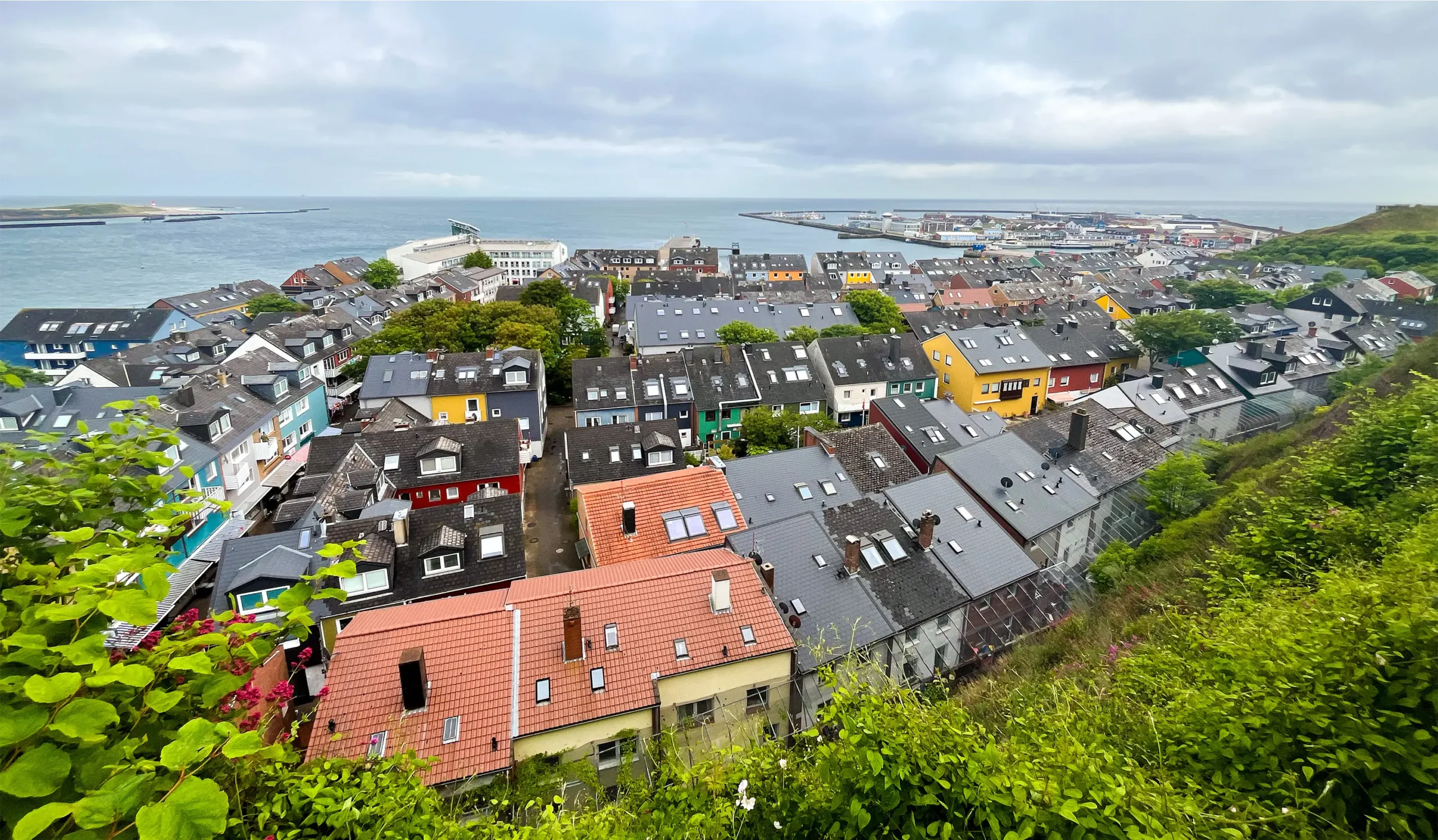Rows of homes and shops stretch out to the coast with the North Sea in the background.