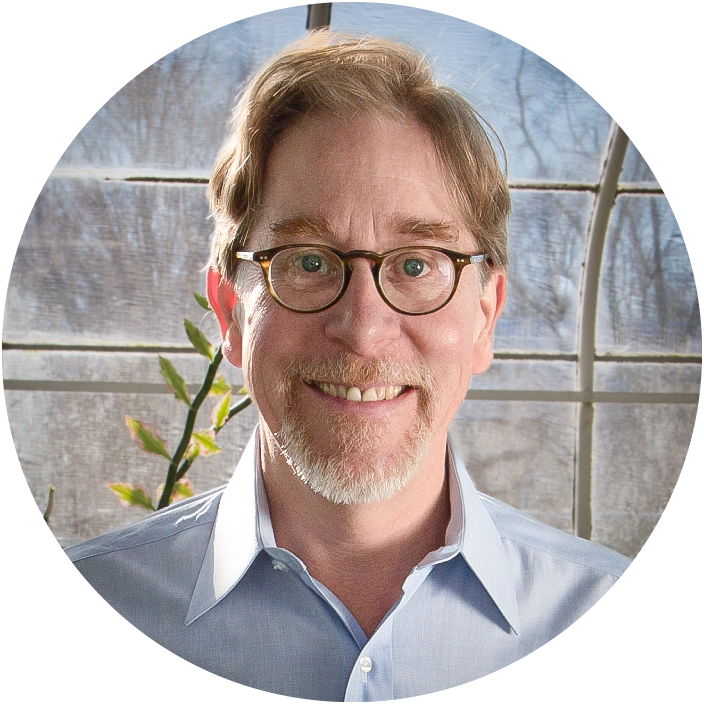 A smiling man with glasses
