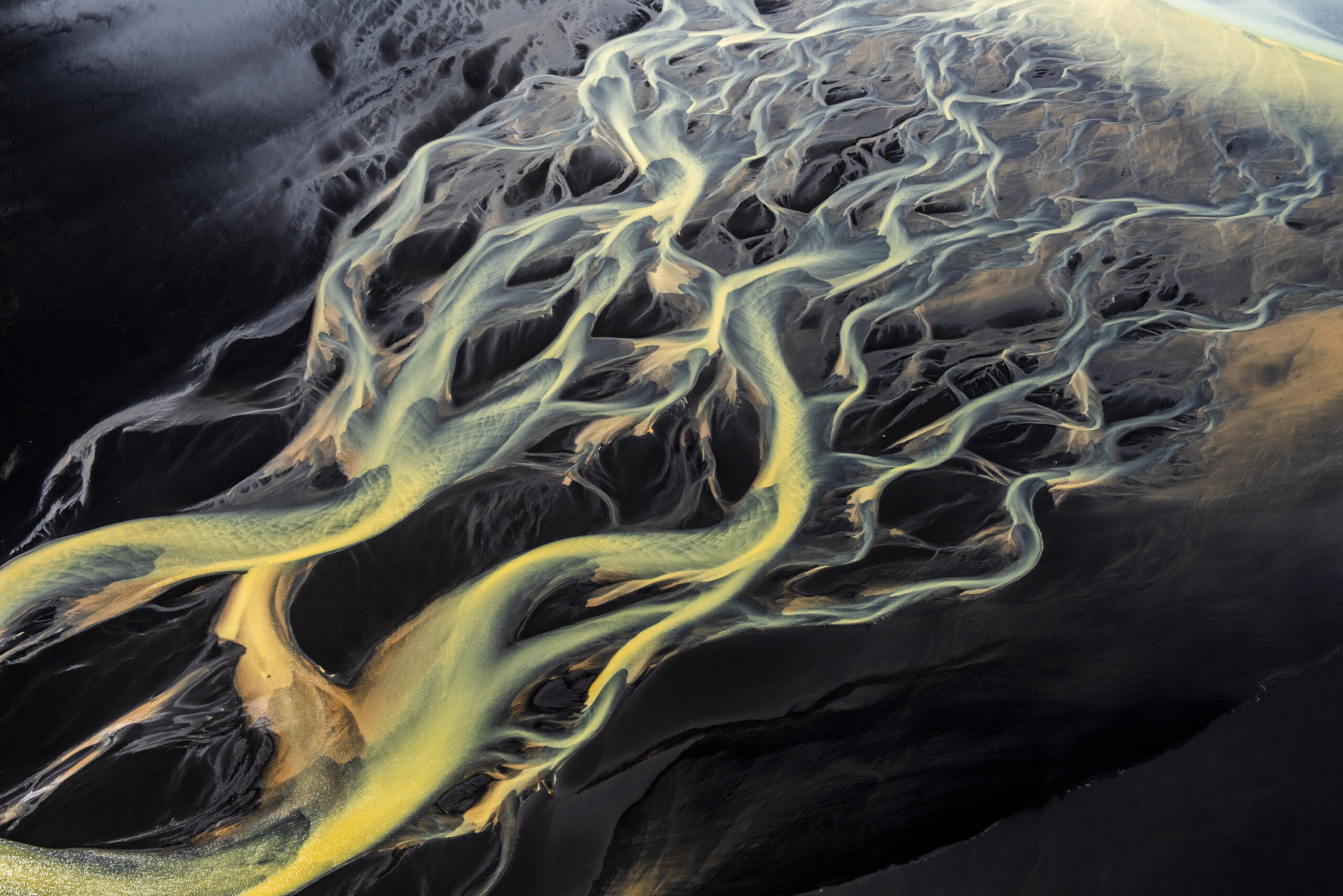Abstract aerial photo of braided glacial rivers.
