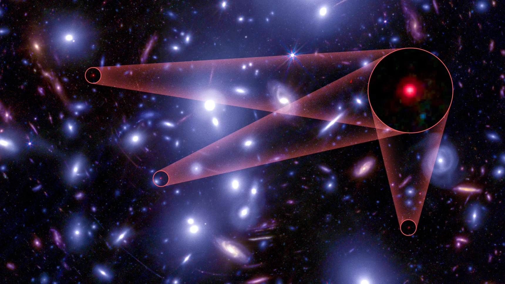 A field of large white galaxies hides three tiny red dots.