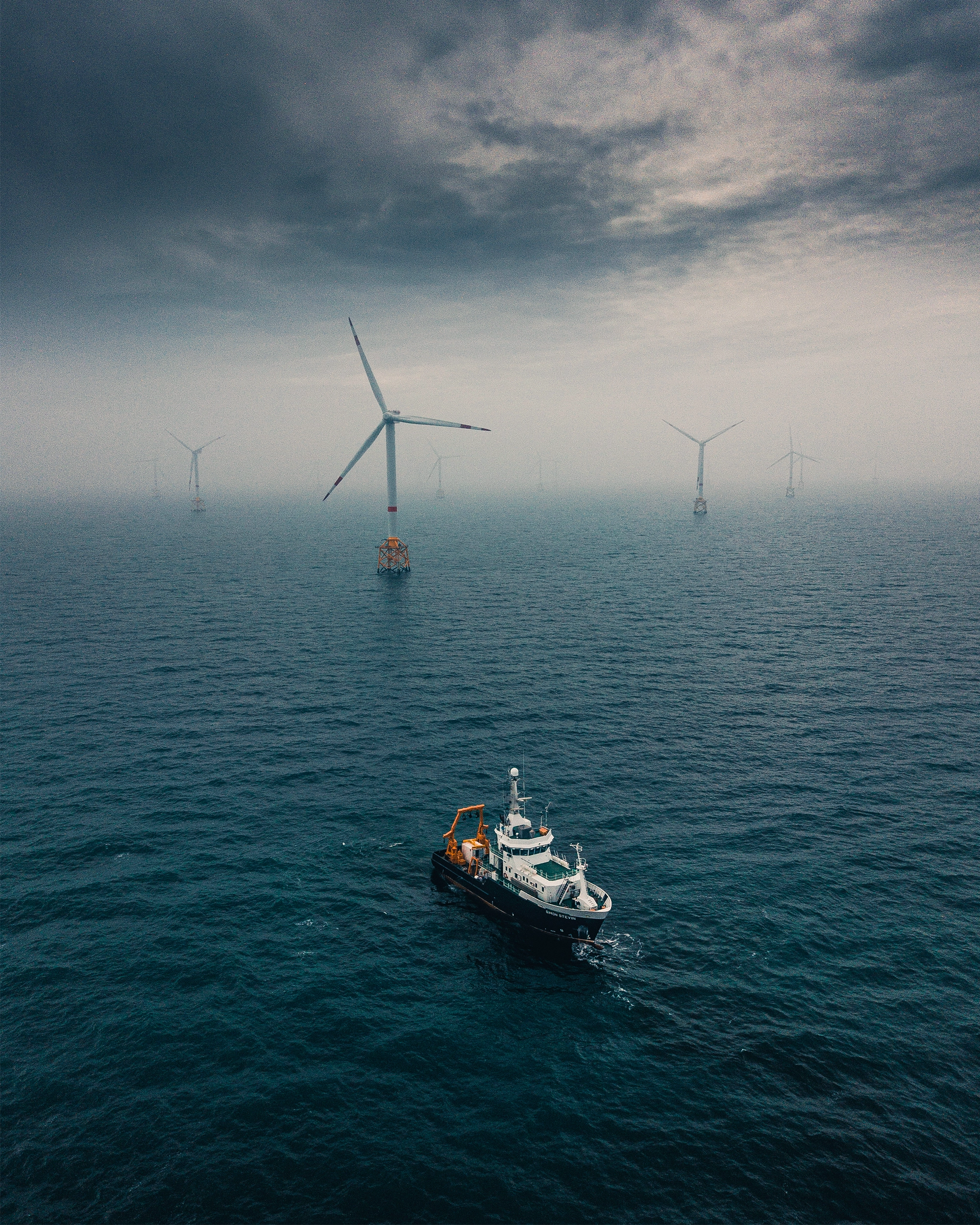 A research ship moves in water.