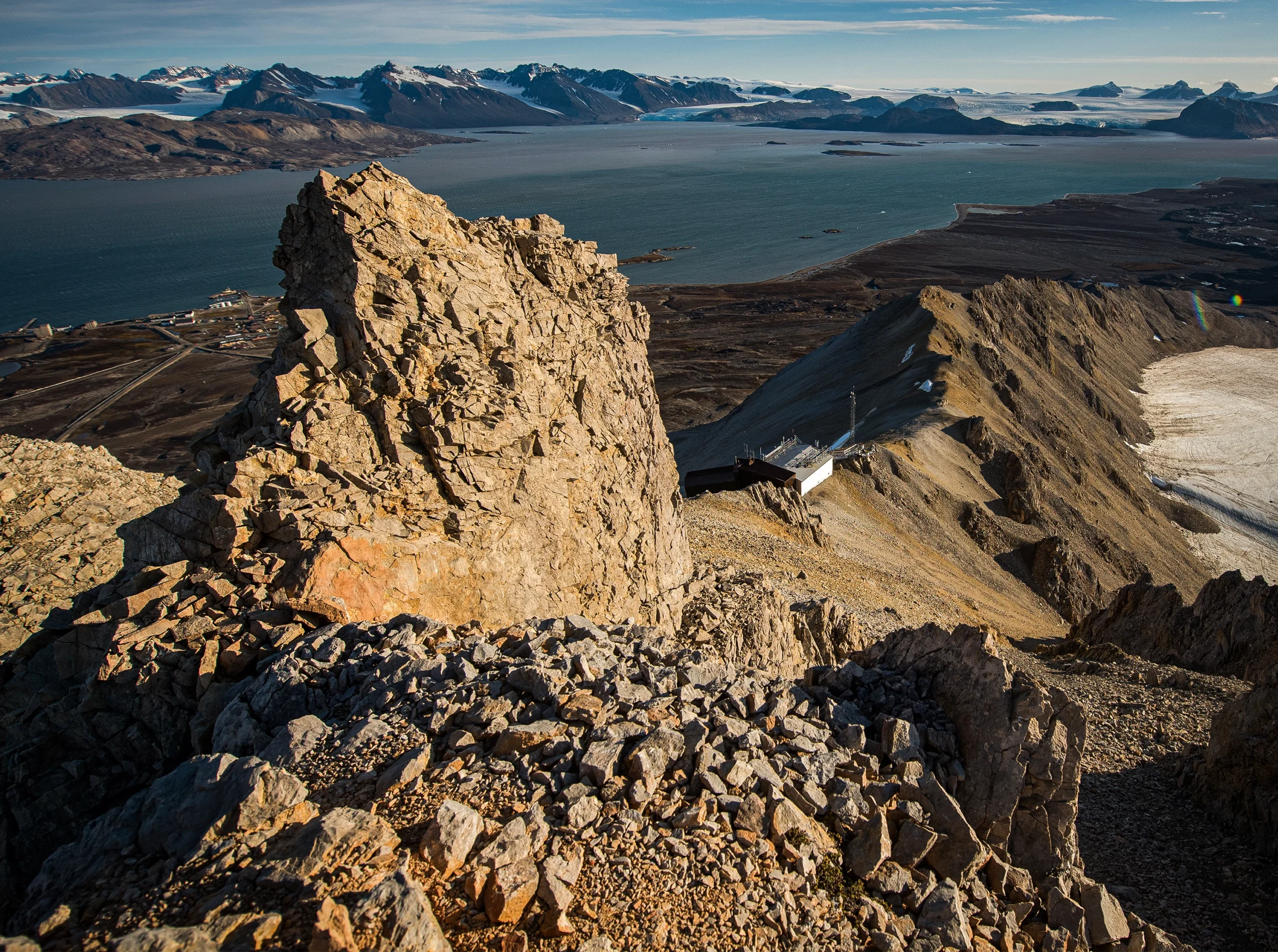 An observatory sits above a hill in a remote location.