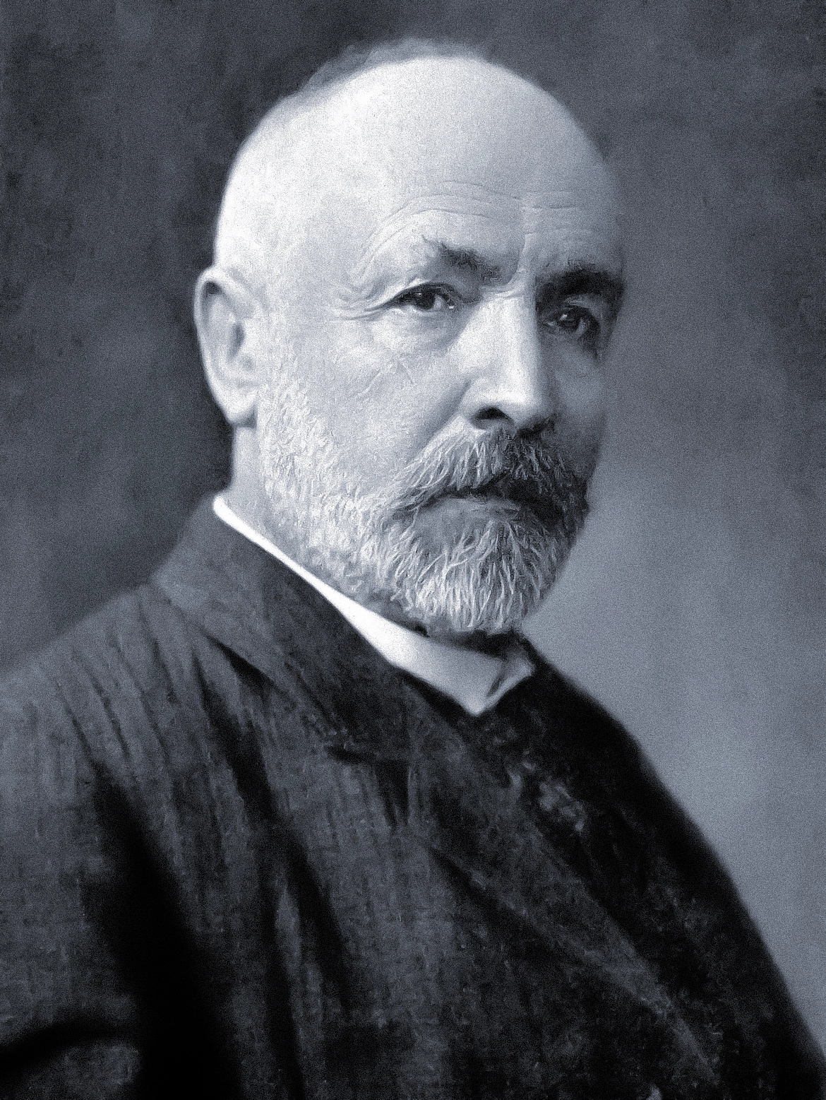 Black-and-white portrait of a man with a beard.