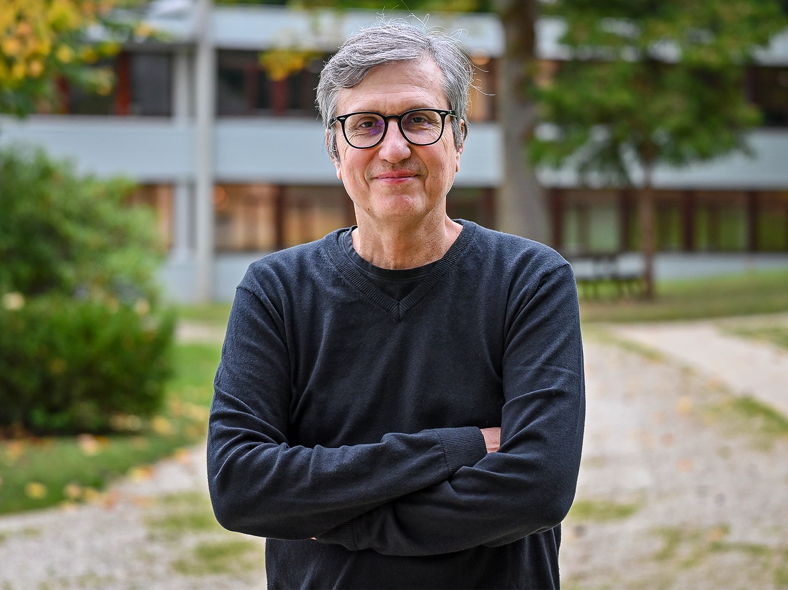 Gray-haired man in glasses.