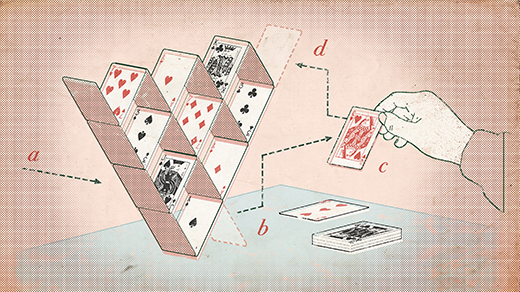 An inverse pyramid built out of playing cards.