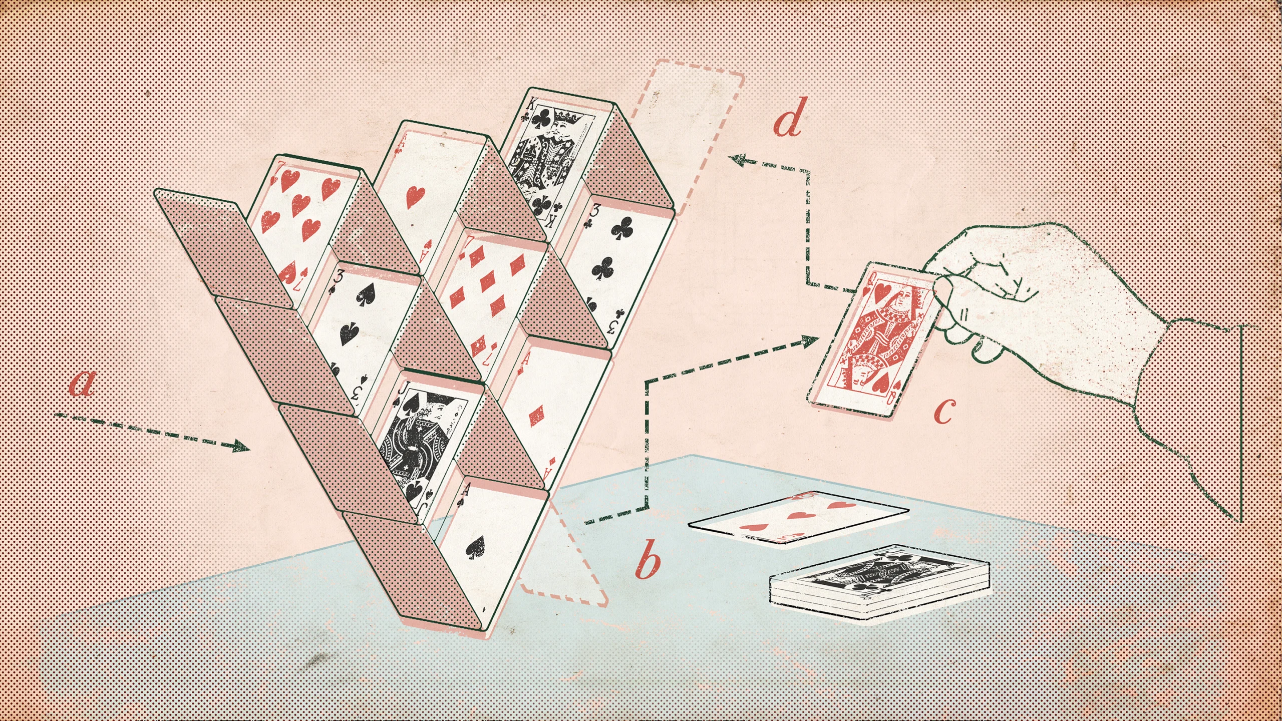 An inverse pyramid built out of playing cards.