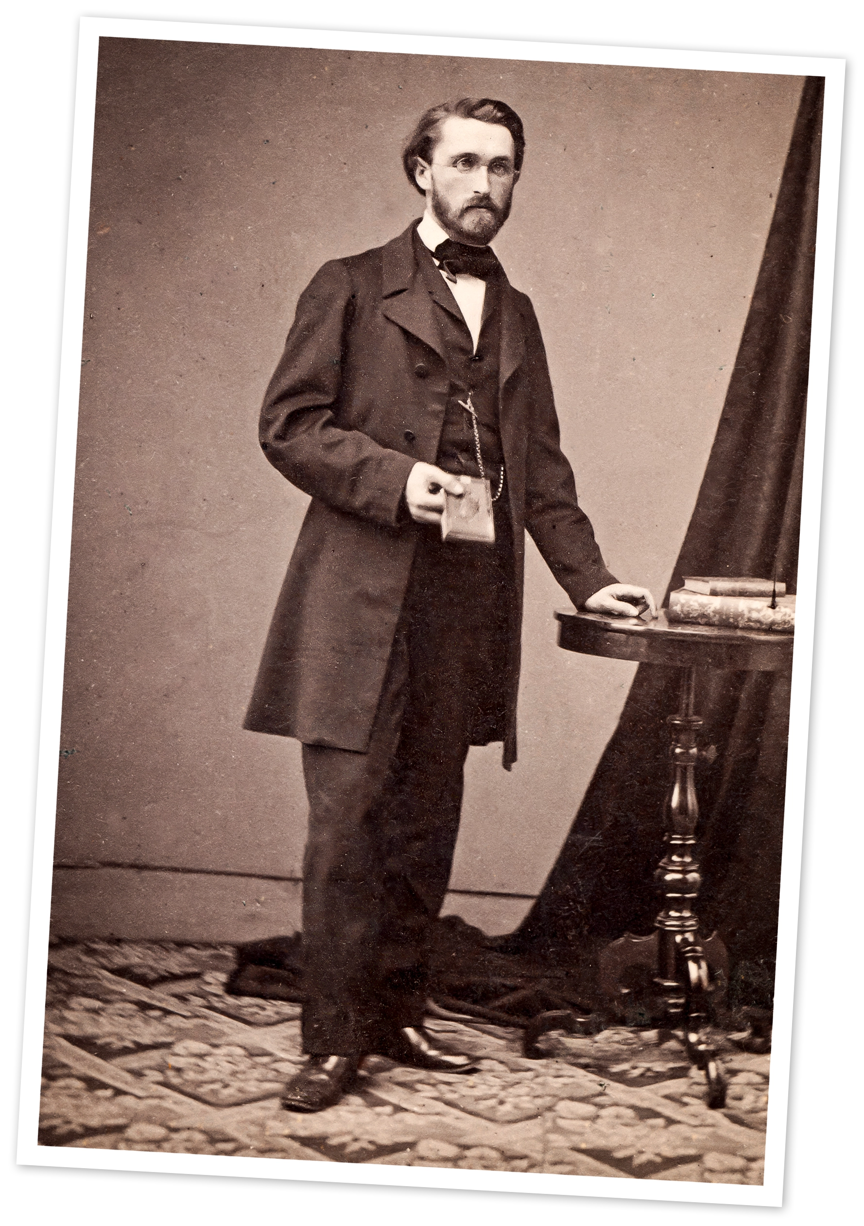 A man in glasses and a suit.