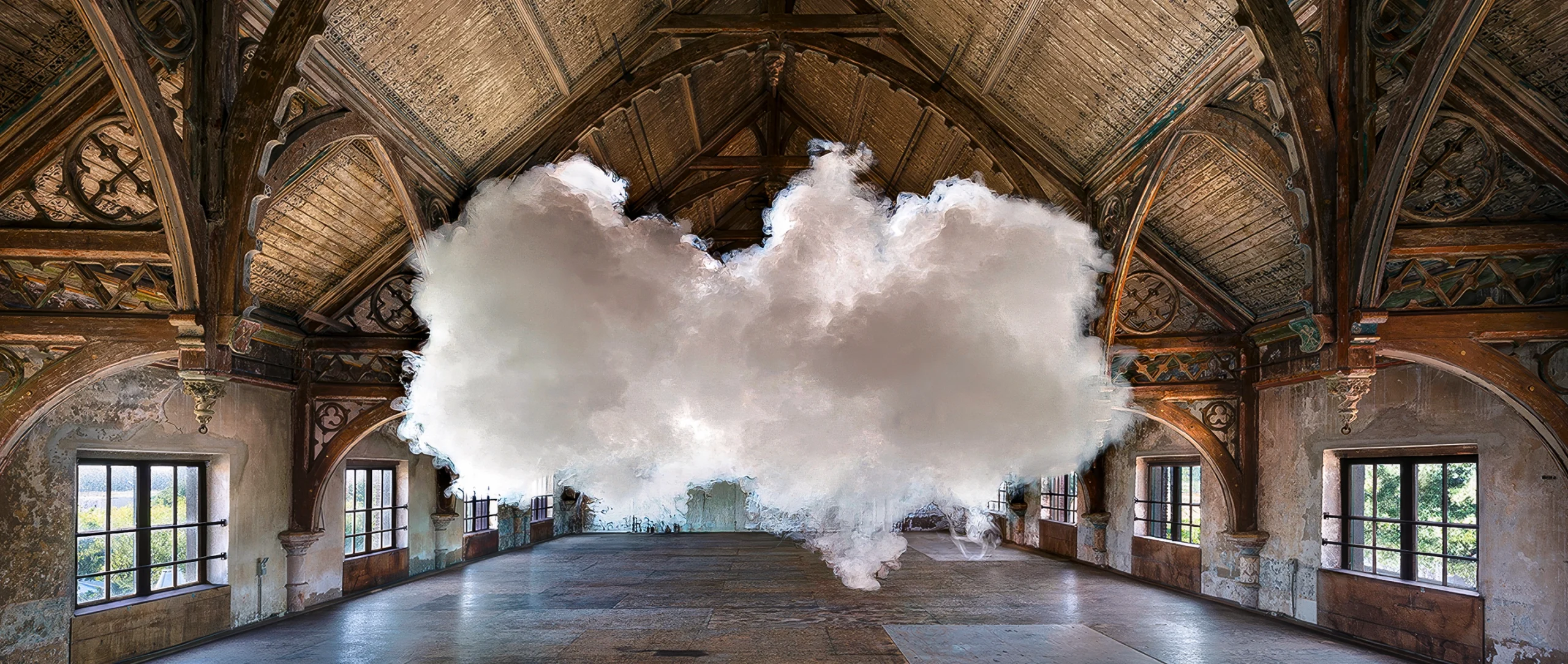 In a photograph staged by artist Berndnaut Smilde, a small cloud hovers inside a room.