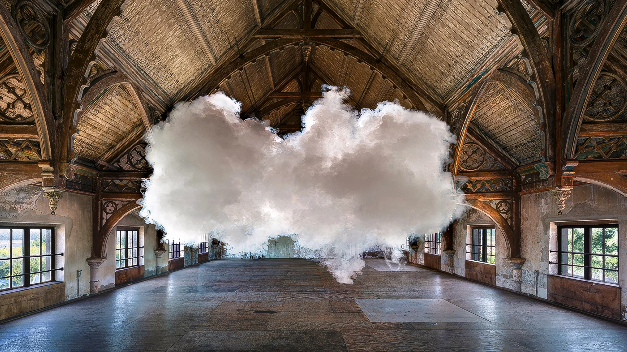 In a photograph staged by artist Berndnaut Smilde, a small cloud hovers inside a room.