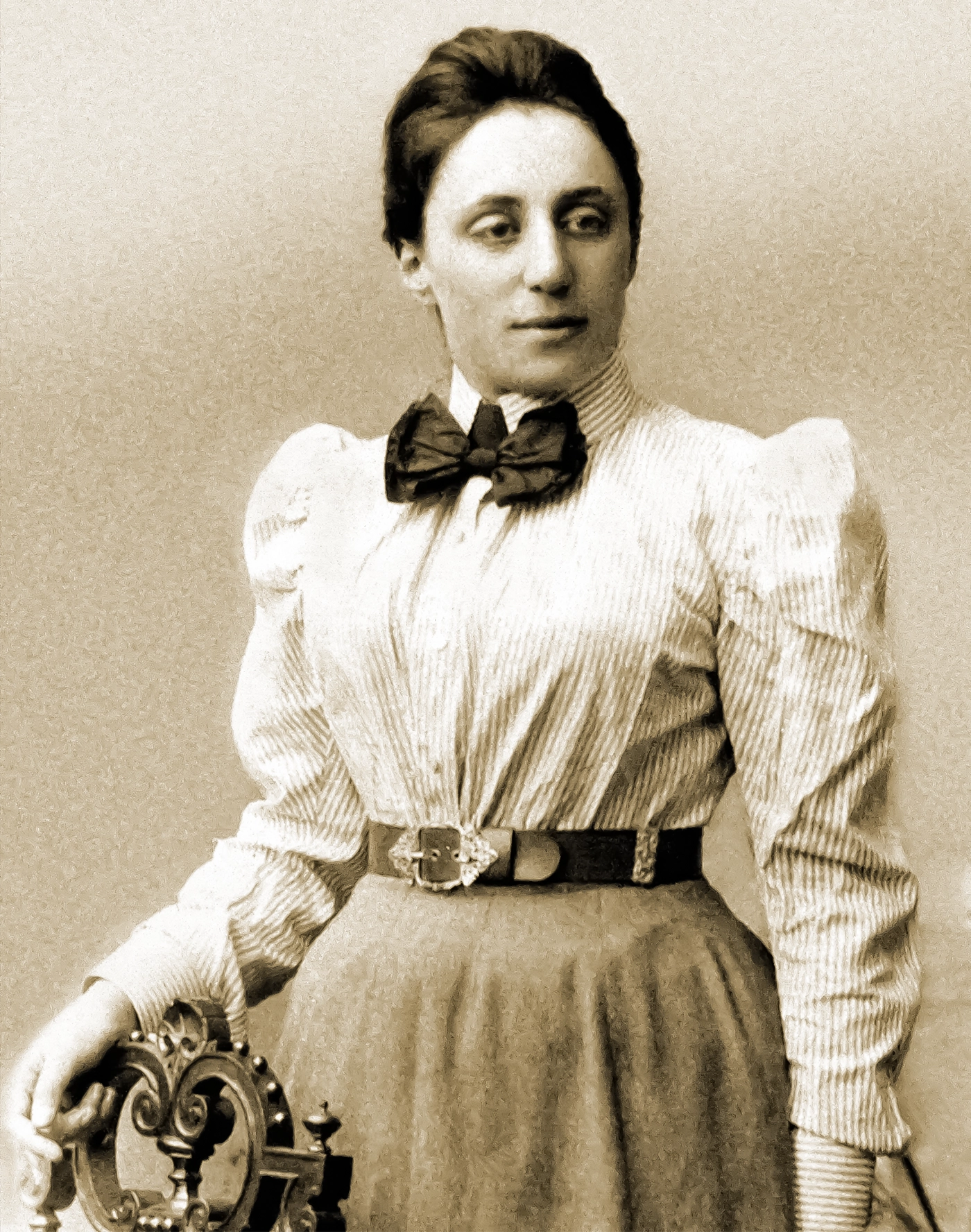 Black-and-white photo of a woman in a striped blouse.