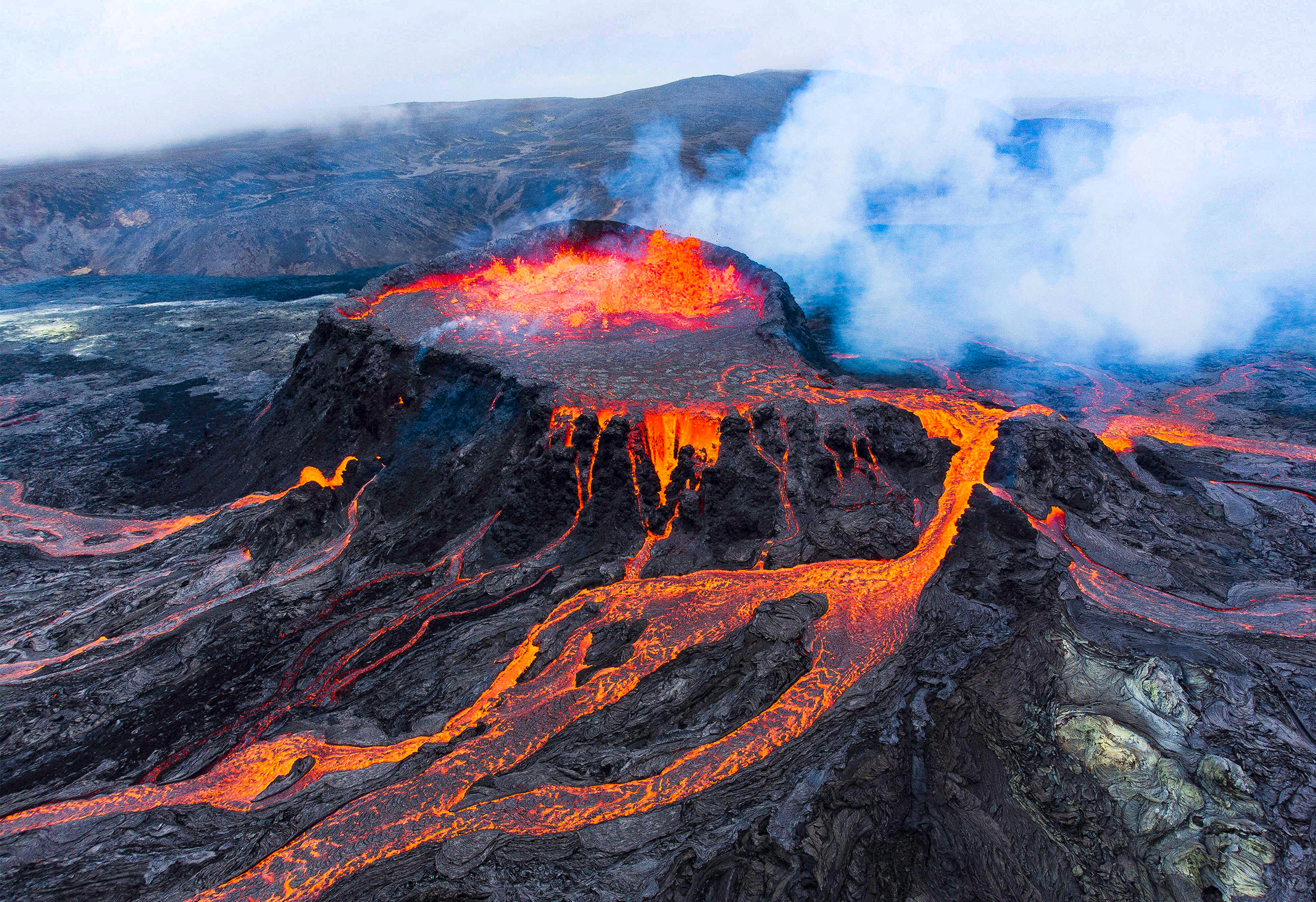 Lava flows across a rocky landscape.