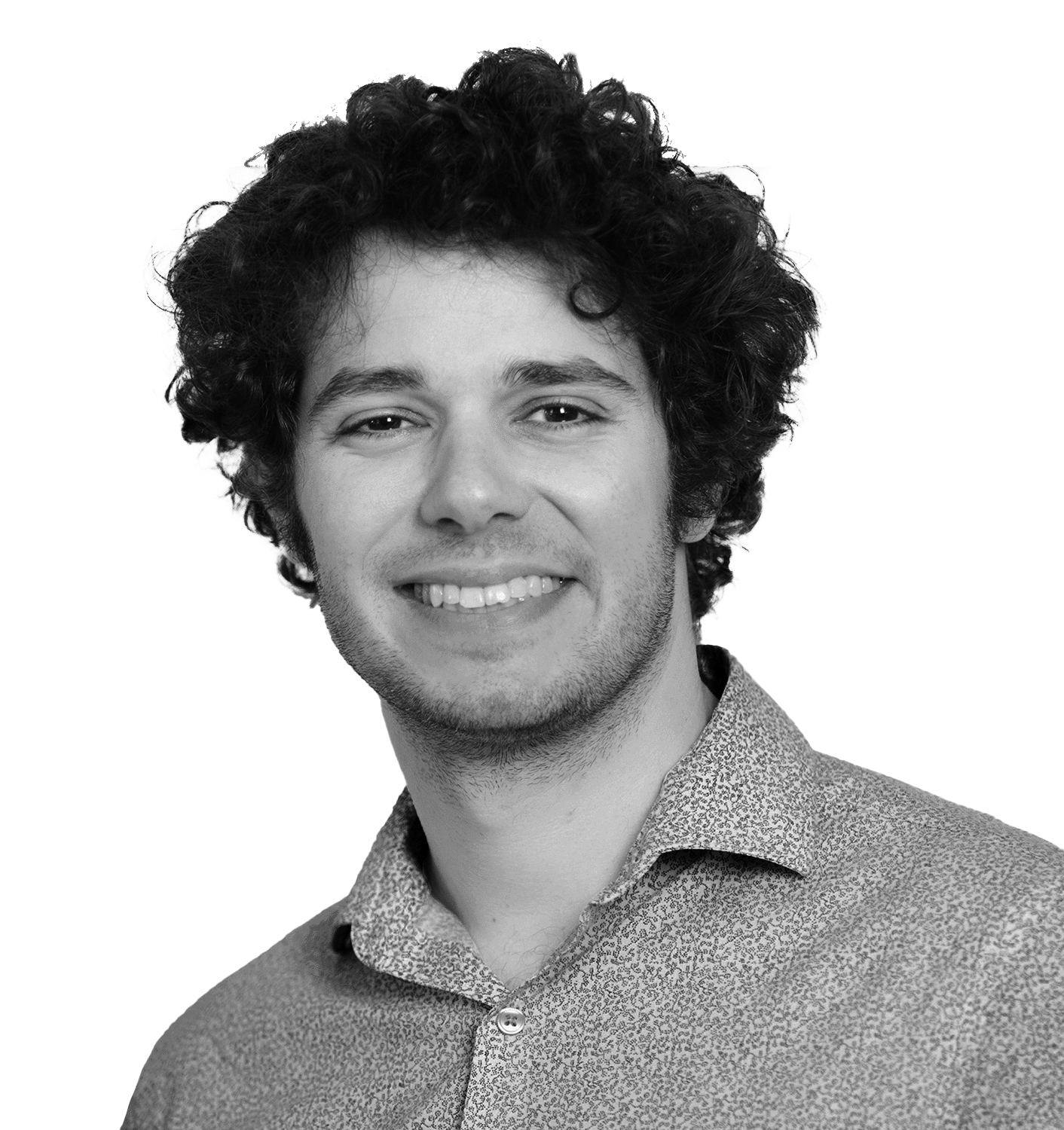 A smiling man with curly hair