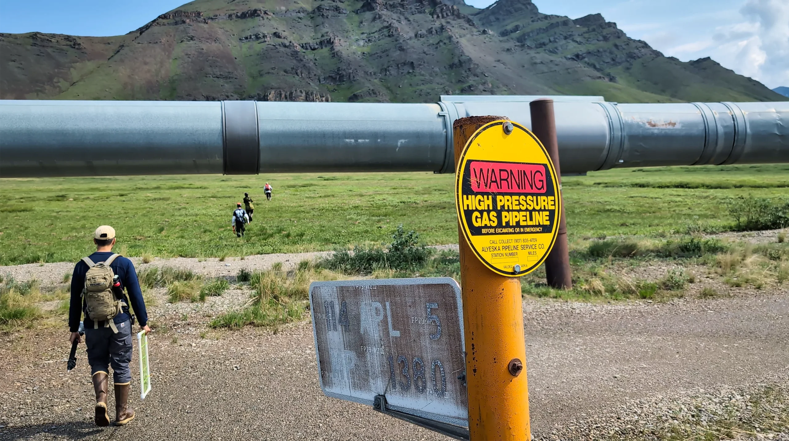 Mario Muscarella, Jinsu Elhance, and Michael Van Nuland unpack their belongings at a sample site.