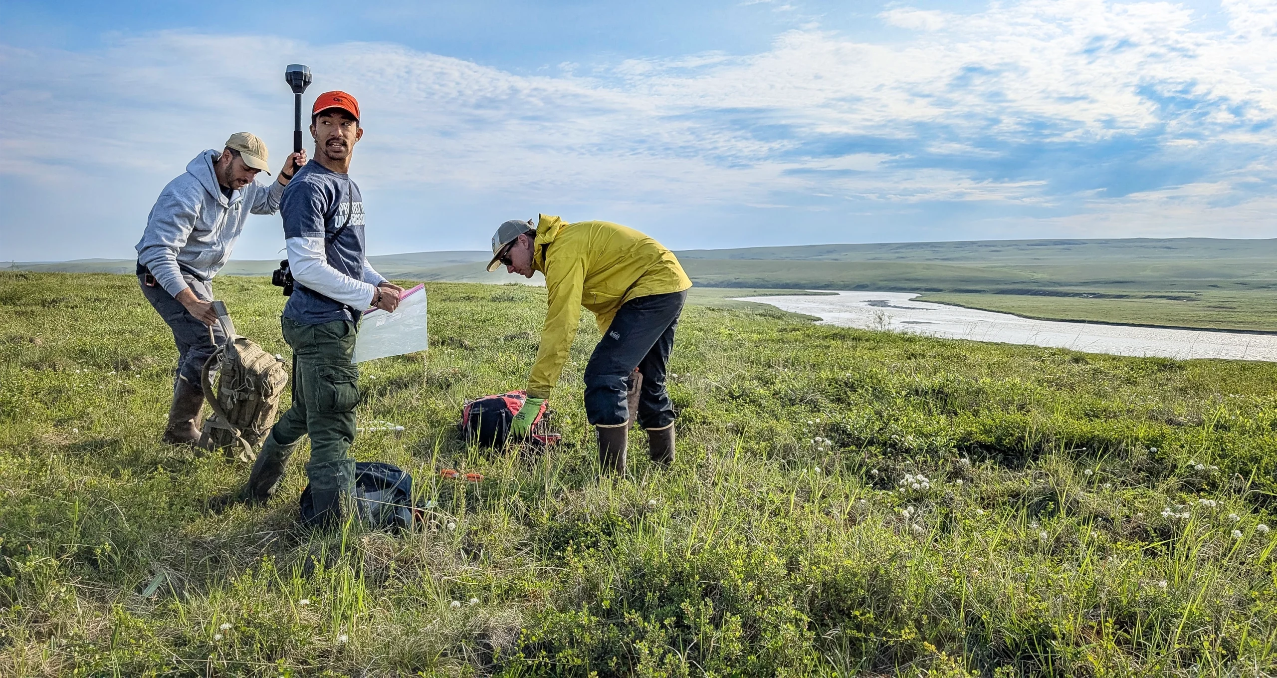 Mario Muscarella, Jinsu Elhance, and Michael Van Nuland unpack their belongings at a sample site.