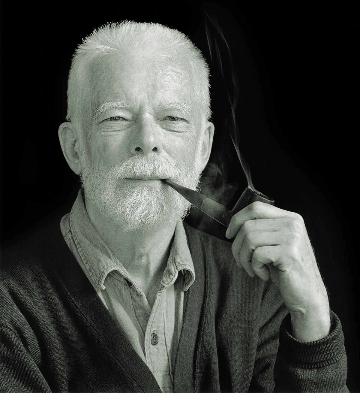 Black-and-white photo of a man with a pipe.