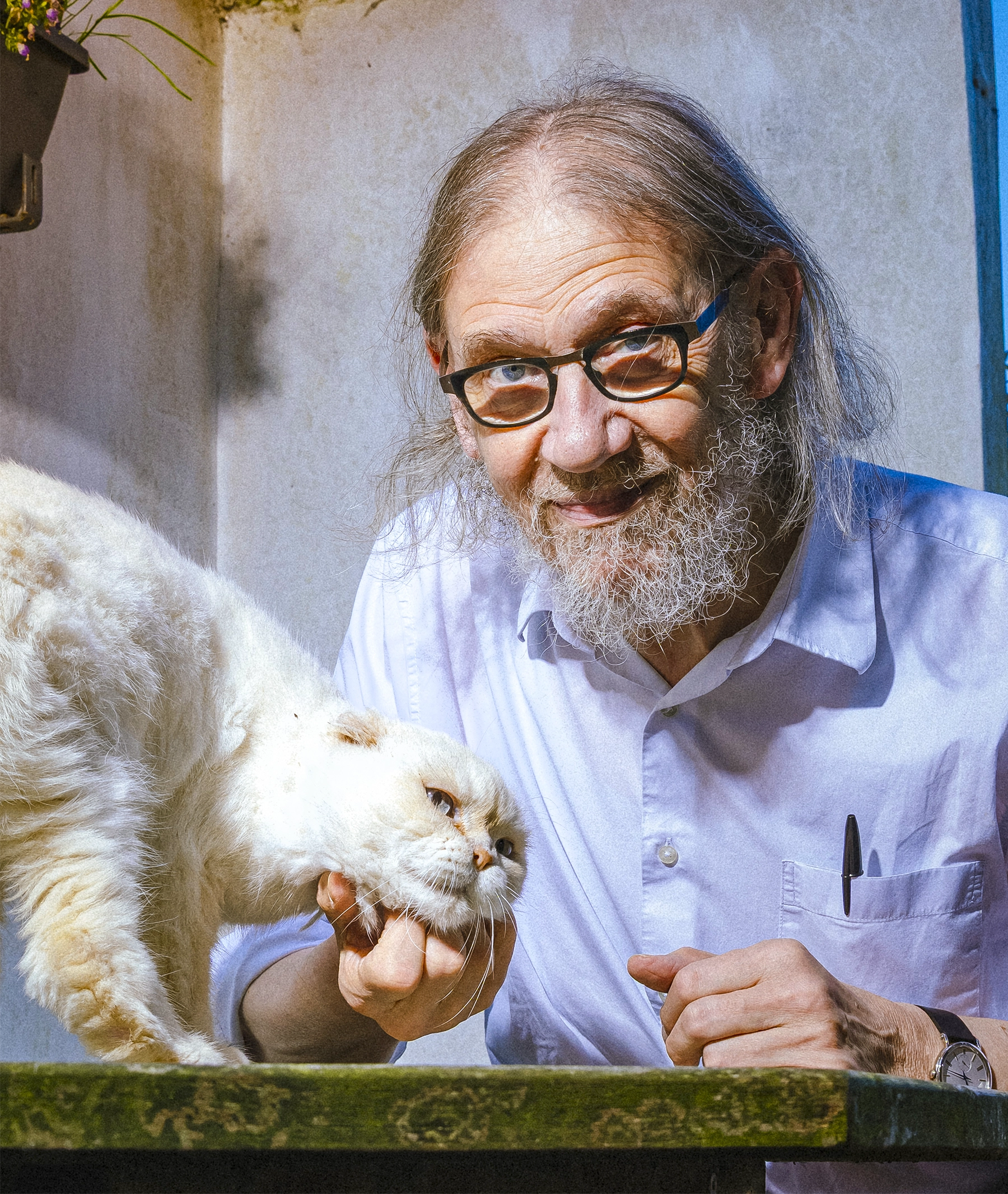 Man with a white cat.