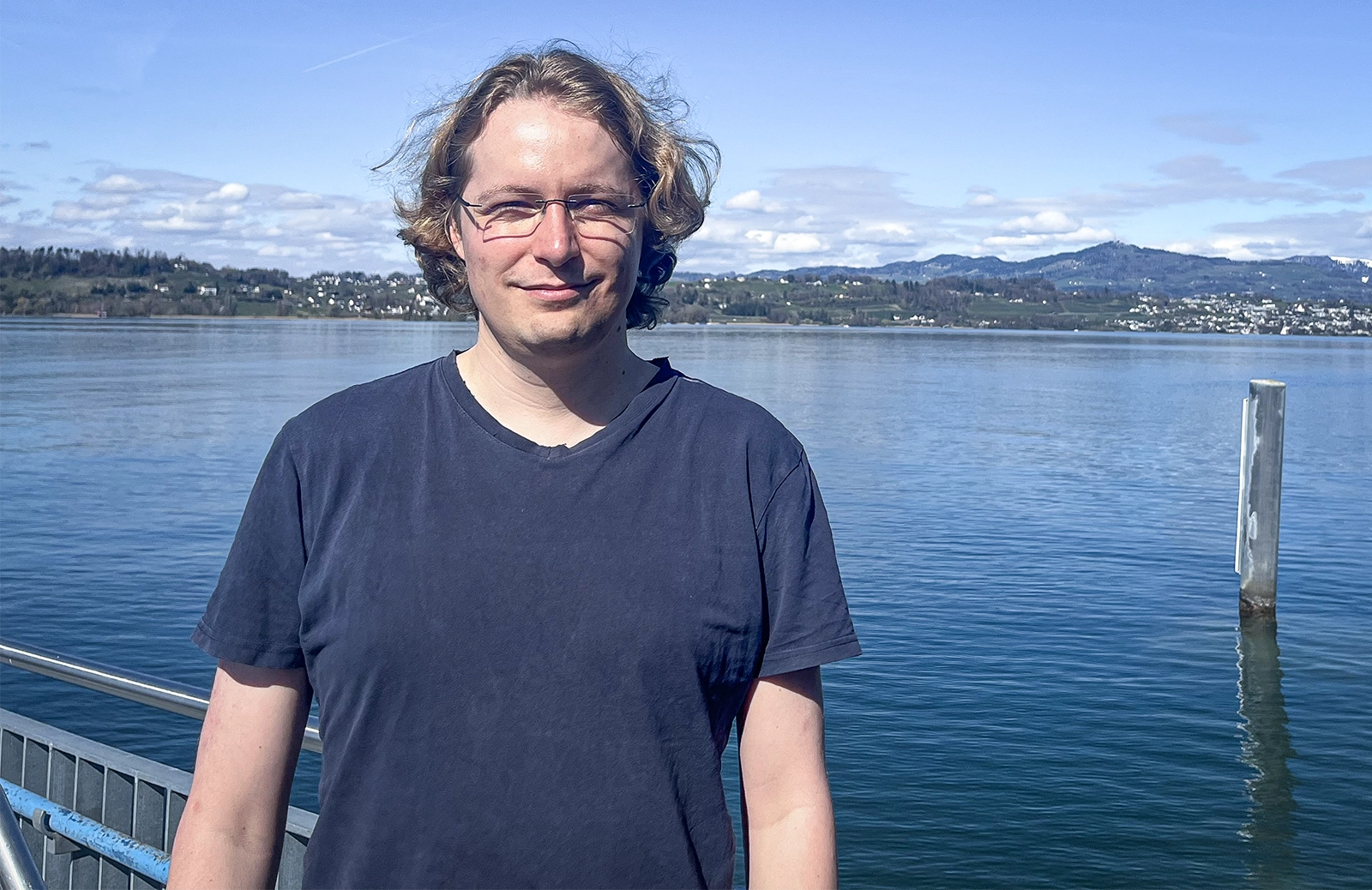 Man smiling outdoors.