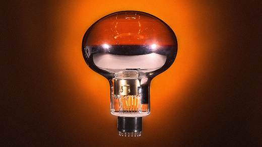 A metallic photomultiplier tube that looks like a large light bulb.