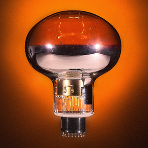 A metallic photomultiplier tube that looks like a large light bulb.