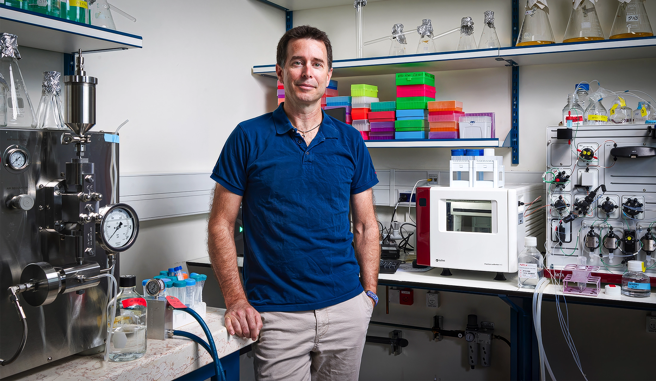 Rotem Sorek stands amid lab equipment.