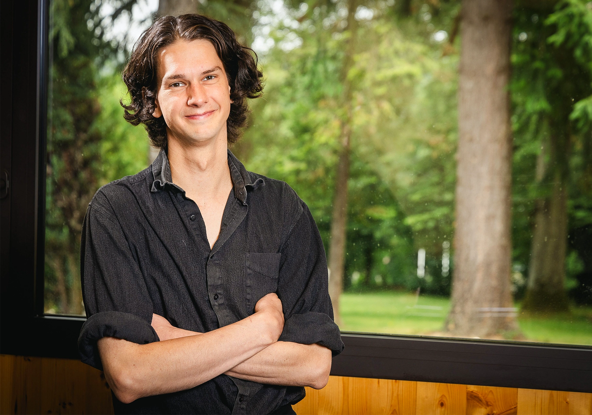 Man with dark shoulder-length hair.