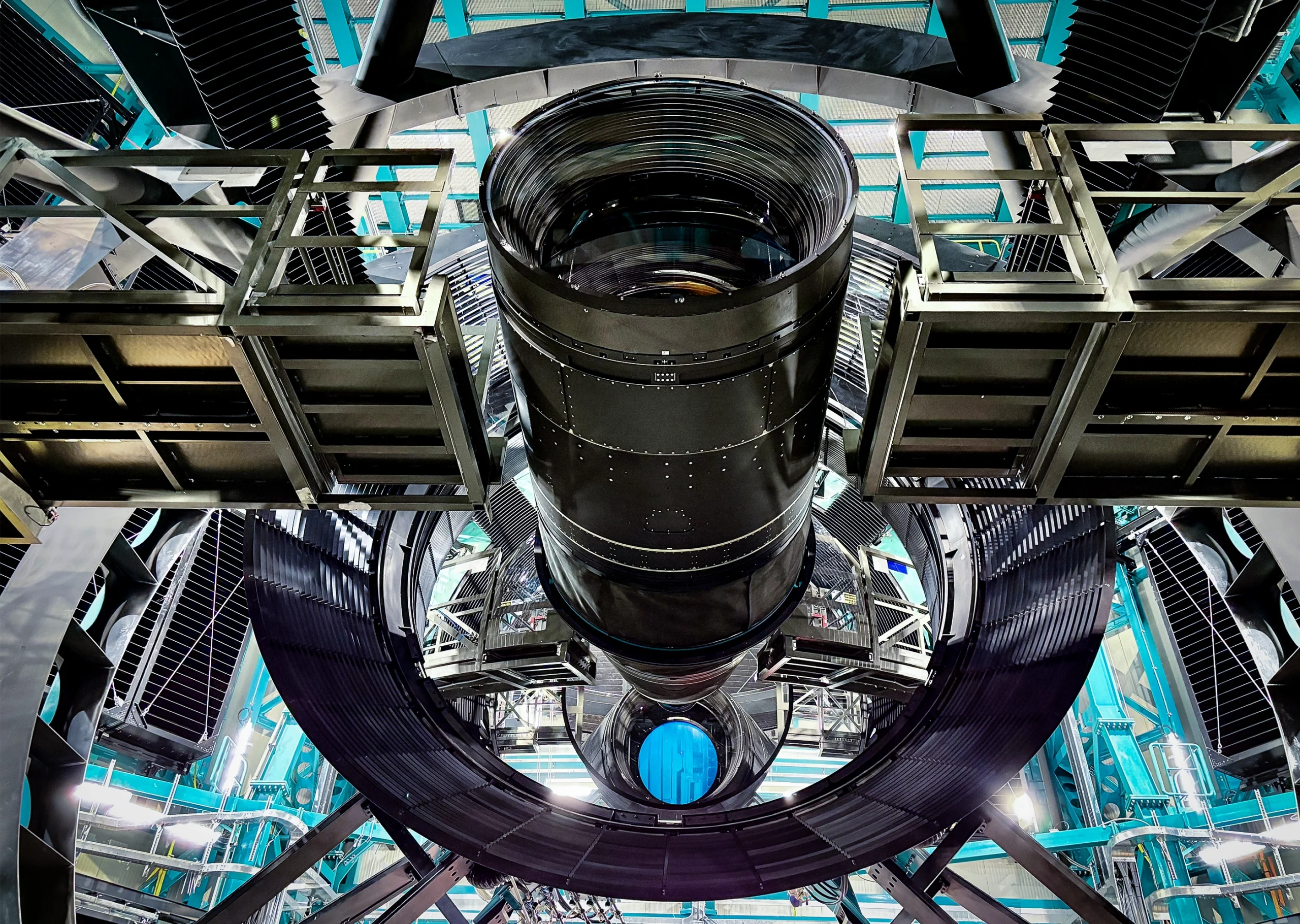 View of the car-size LSST Camera from a low angle, with its secondary and tertiary mirrors in view.