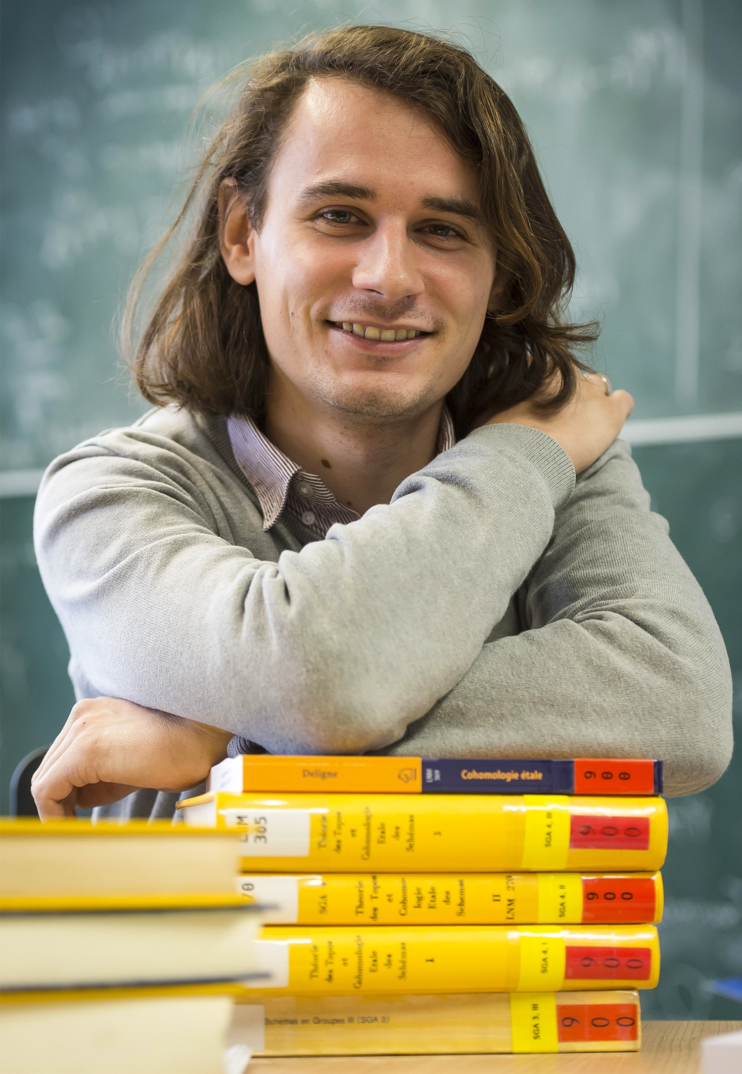Man with shoulder-length brown hair.