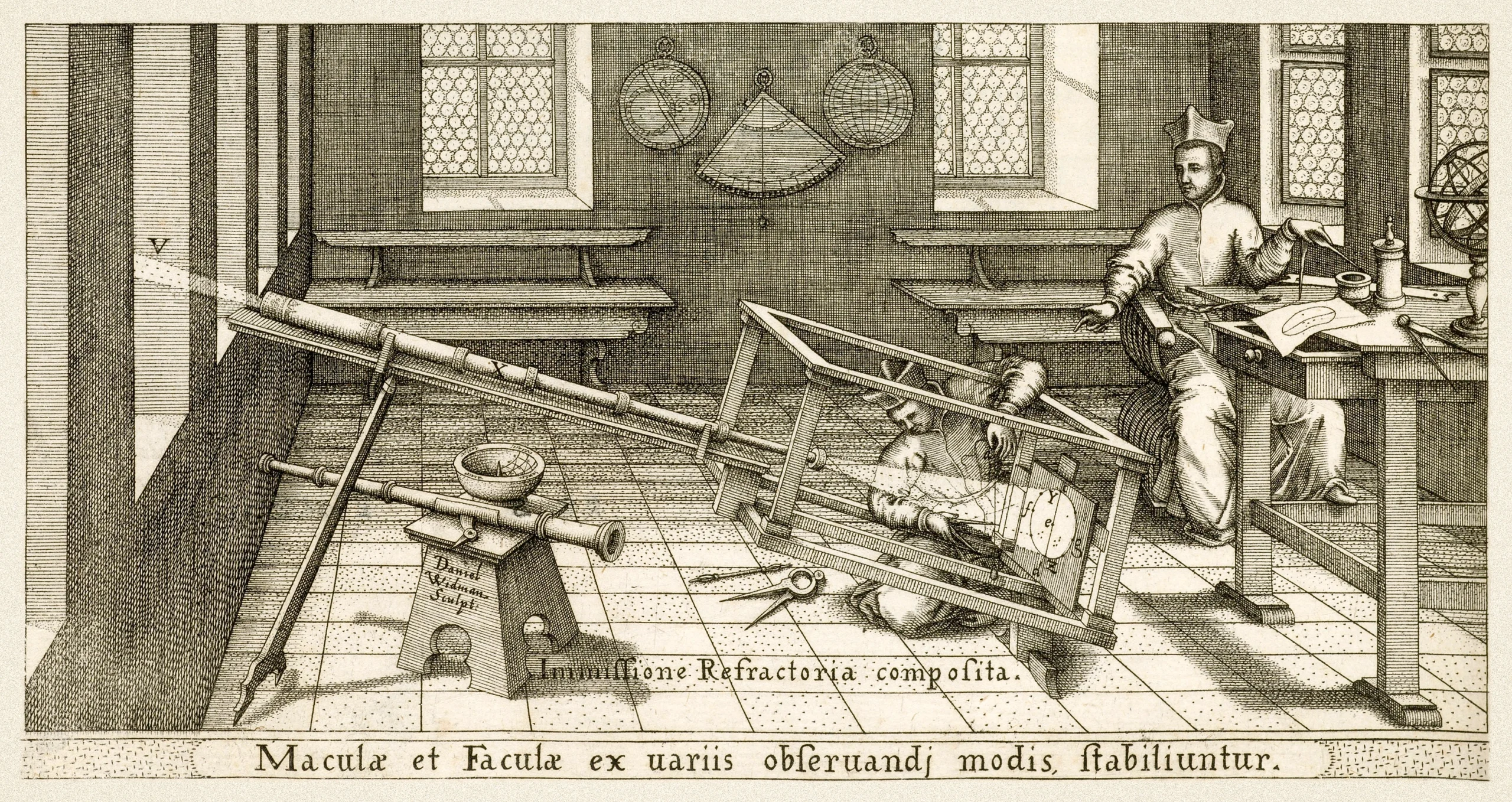 A 17th-century engraving depicting two astronomers observing sunspots using a refracting telescope and projection method. A beam of light enters through a wall on the left and passes through a large telescope mounted on a wooden frame, projecting an image of the sun onto an angled screen held by an assistant lying on the floor, who traces the sunspot positions onto paper. On the right, a second figure wearing a clerical cap sits at a desk recording observations.