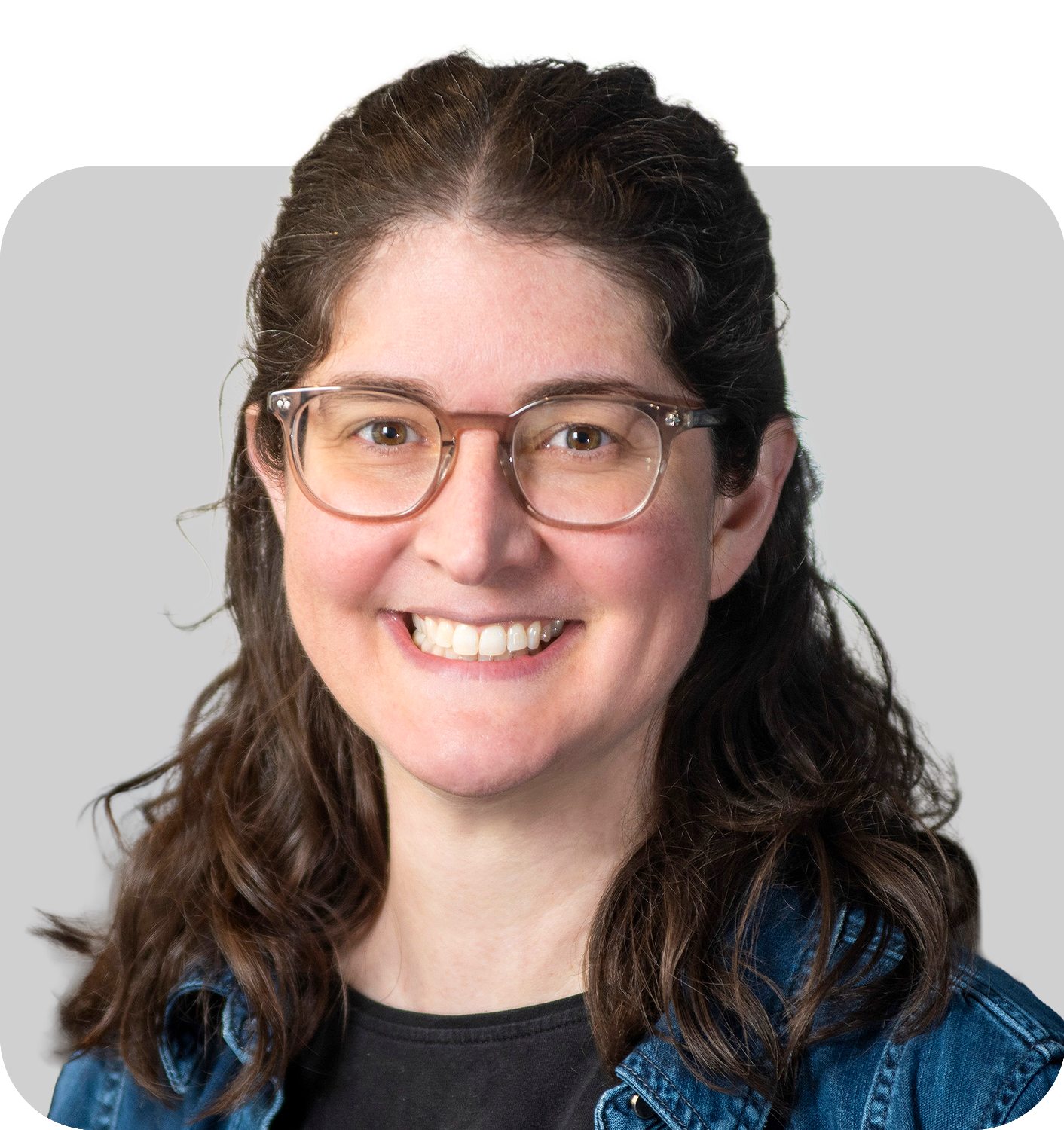 A smiling woman with glasses