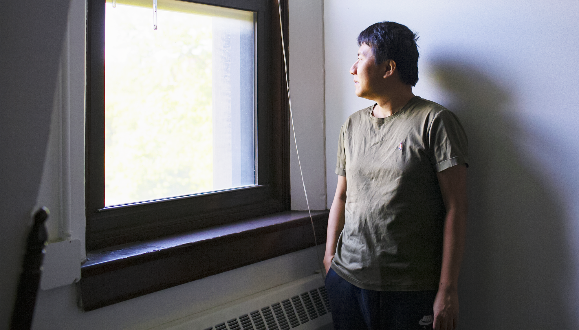 A man looking out the window.