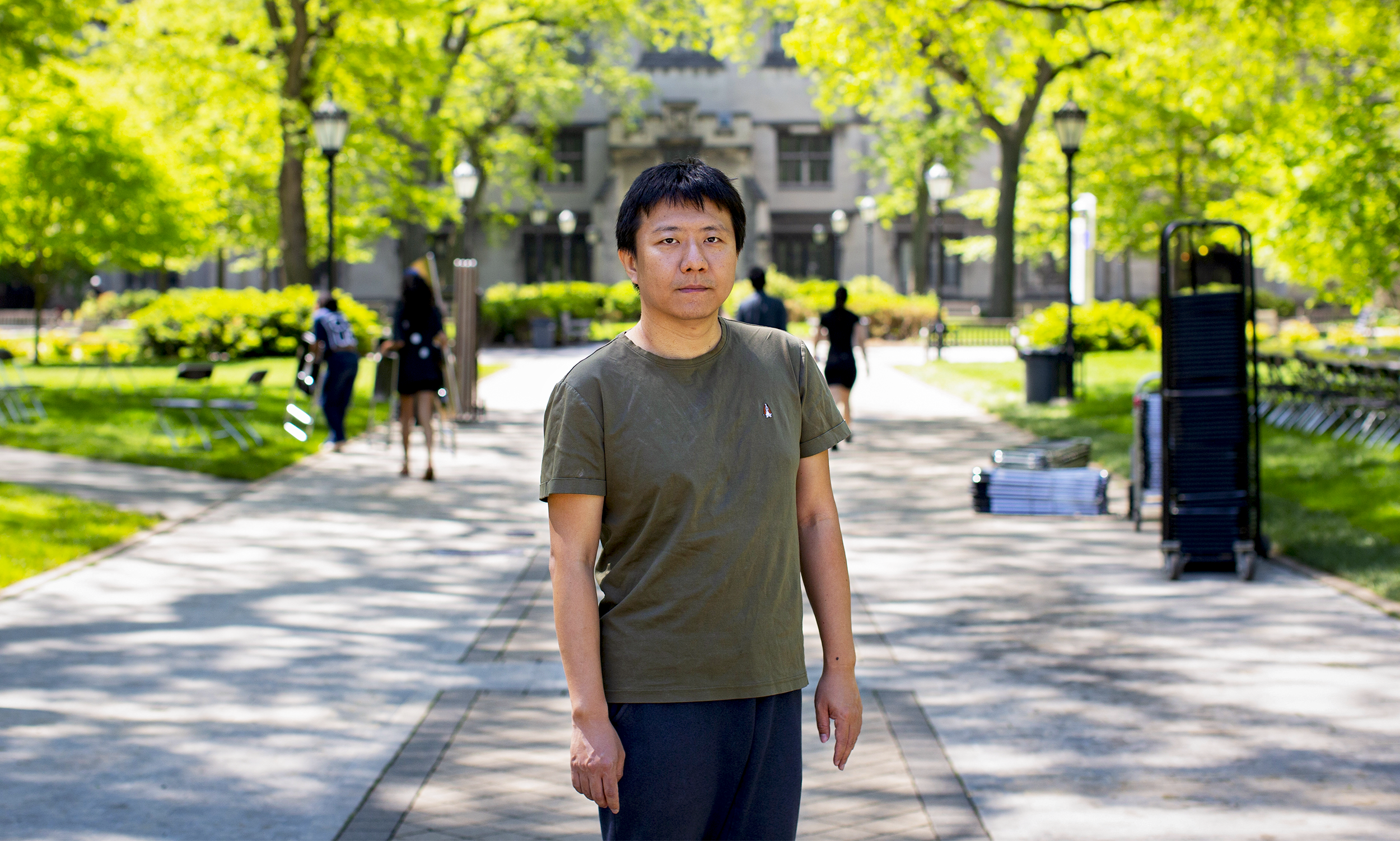 A man standing in a walkway.