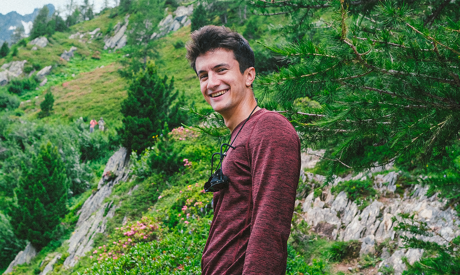 Man in front of a mountain.