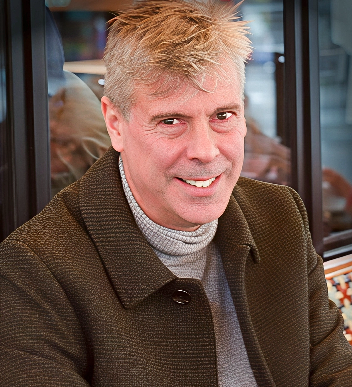 Portrait of a man sitting in front of a window